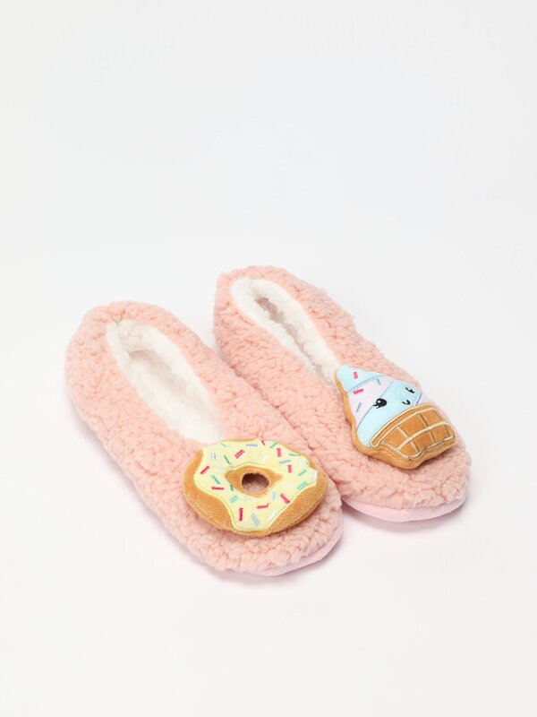 Soft-touch donut slippers