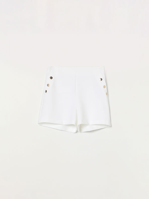 Shorts with gold-toned buttons.