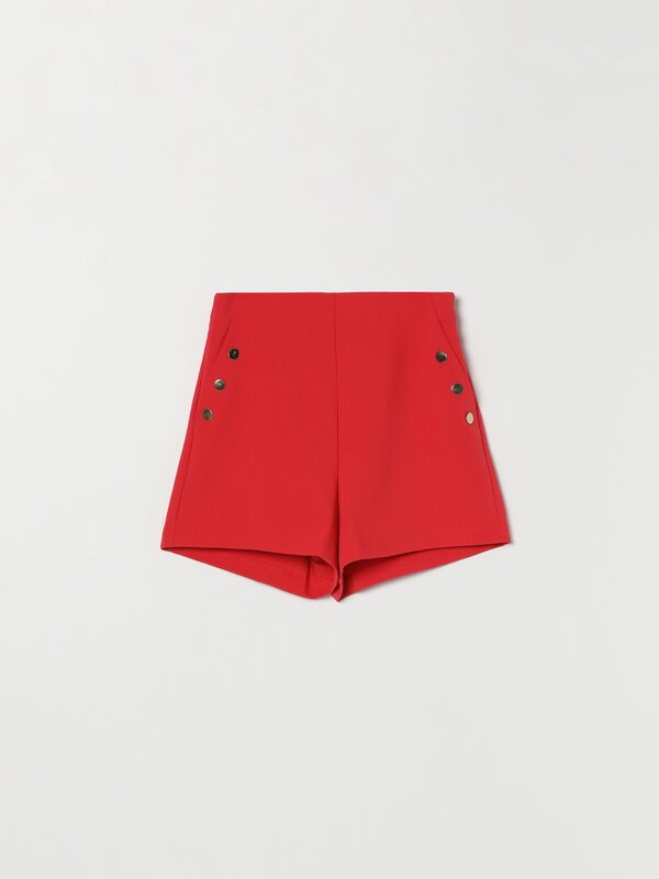 Shorts with gold-toned buttons.