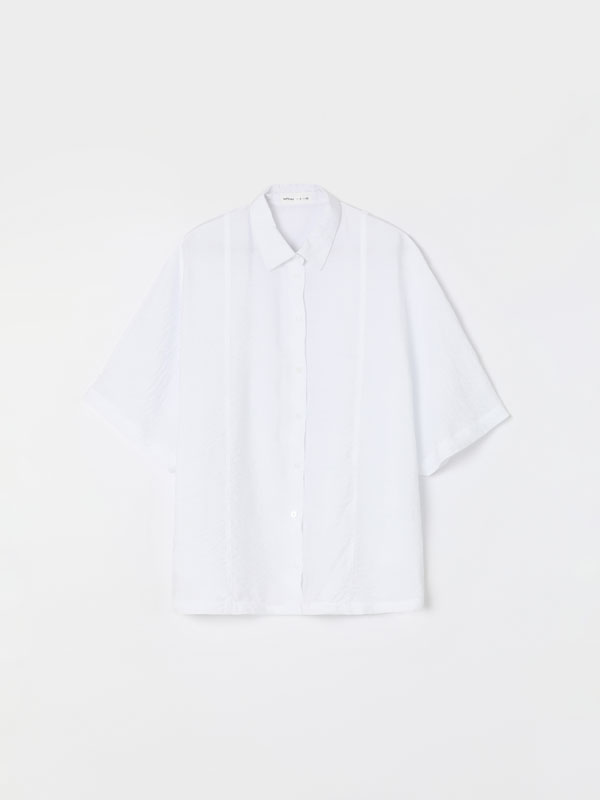 camisa blanca corta