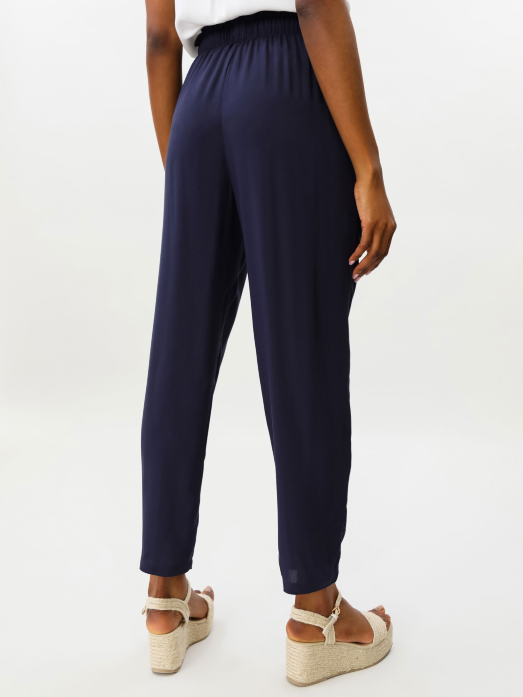 Pantalón fluido con lazada - Pantalones Vestir - PANTALONES - TODA LA  COLECCIÓN - MUJER - | Lefties ESPAÑA