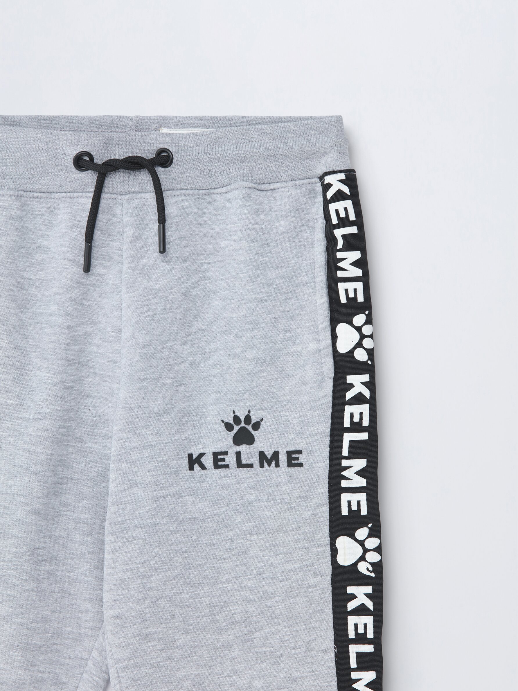 Joggers with side slogan KELME x LEFTIES