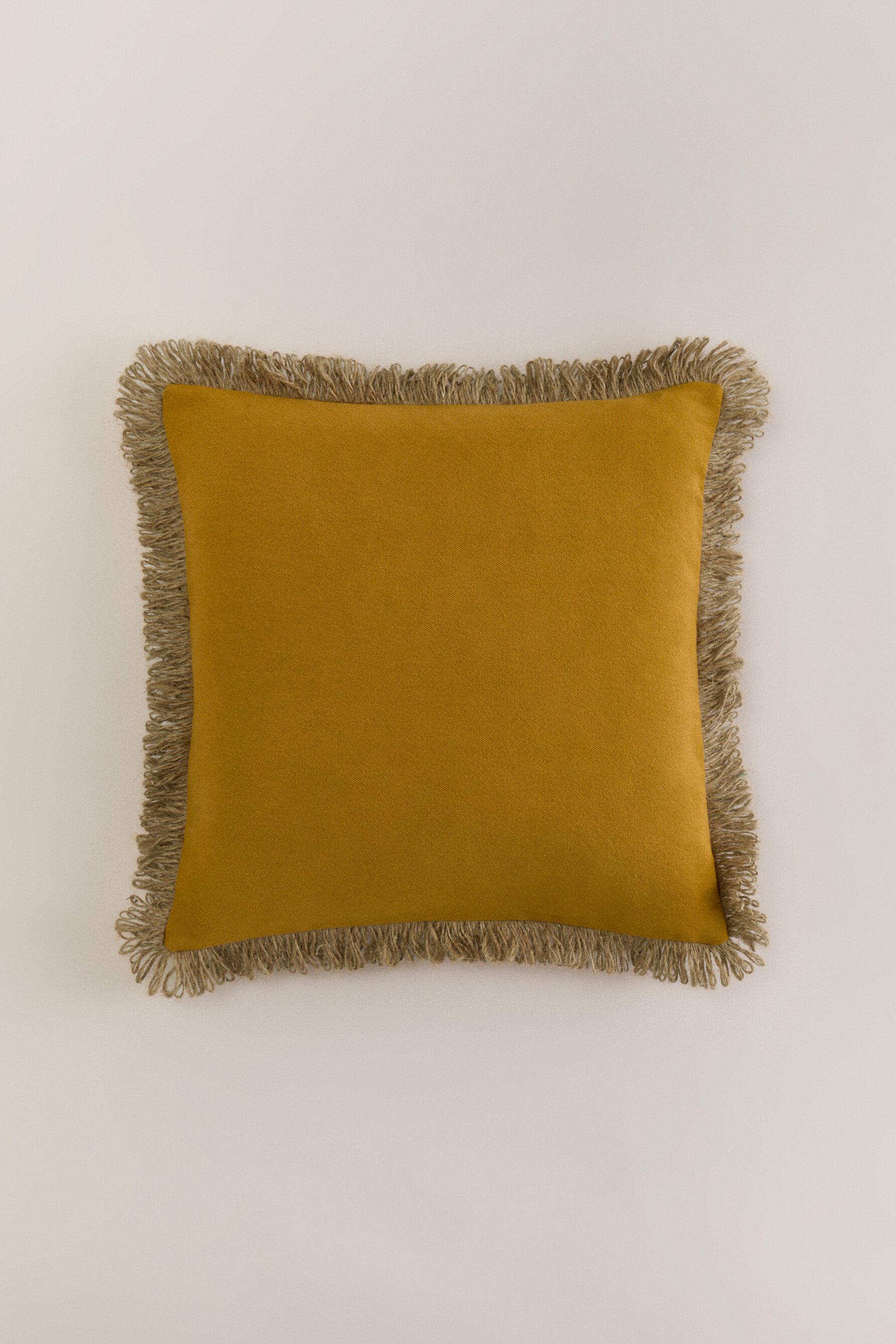 Funda cojín flecos (50 cm. x 50 cm.)