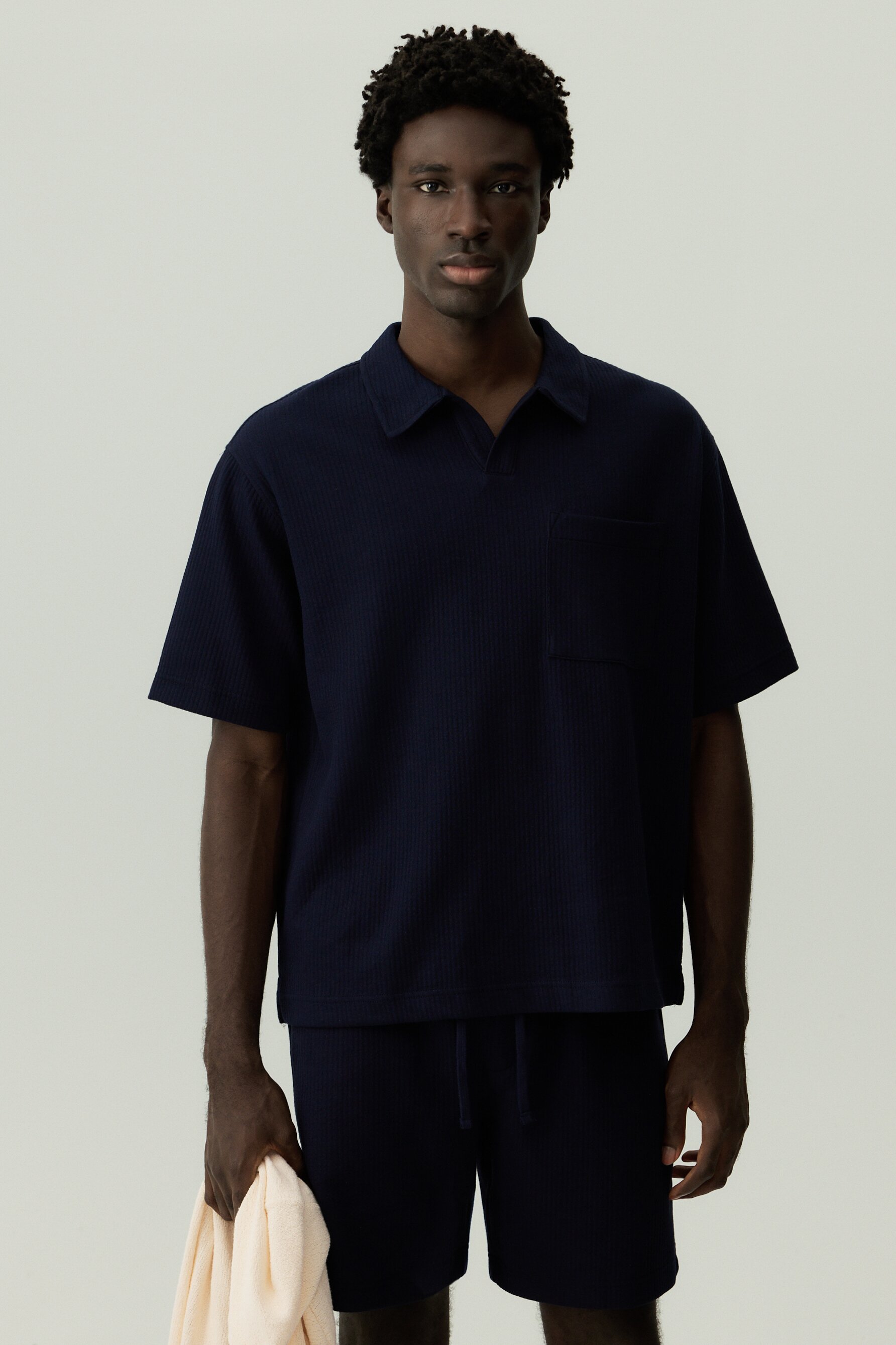 Polo textura bolsillo