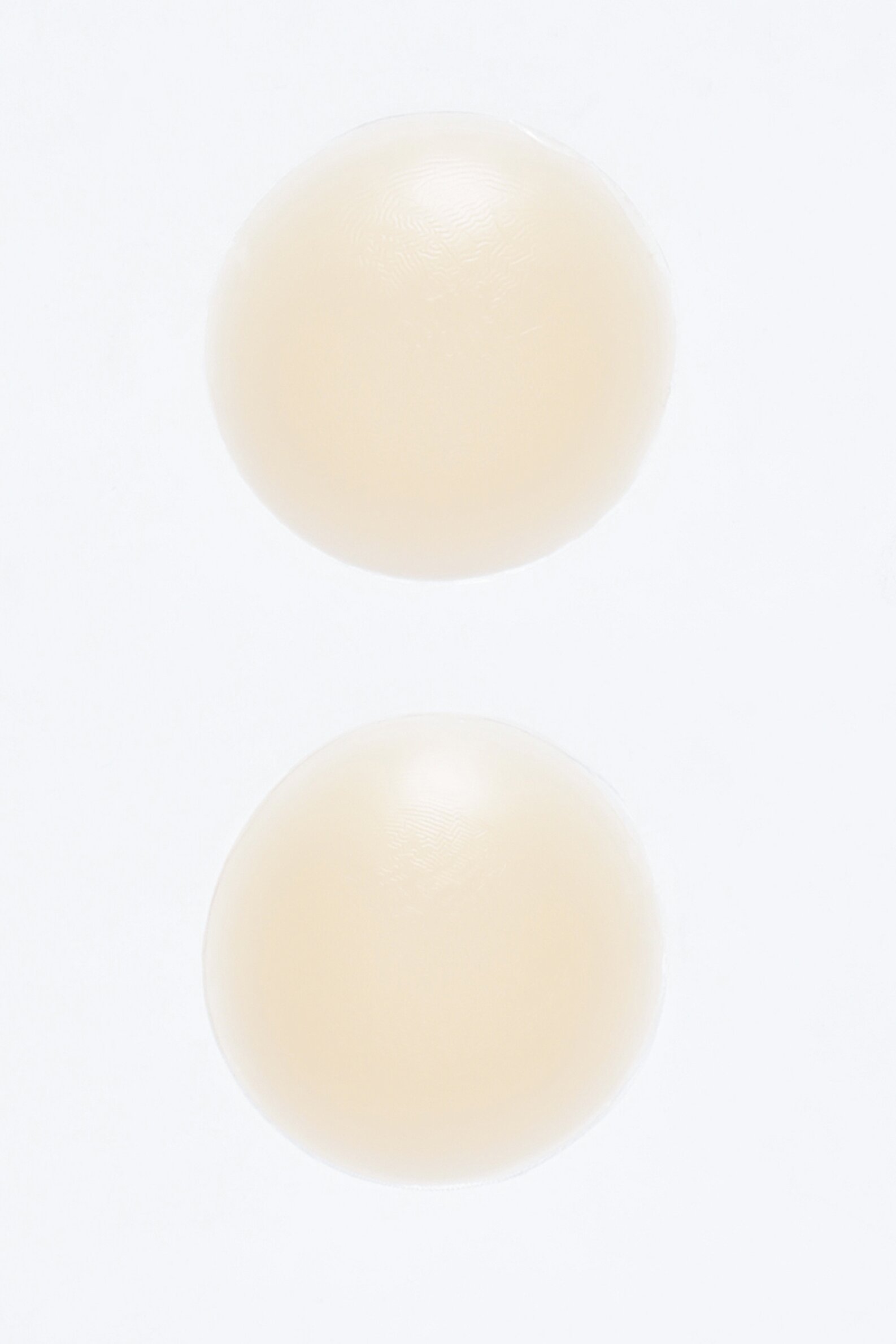 Adhesive nipple covers