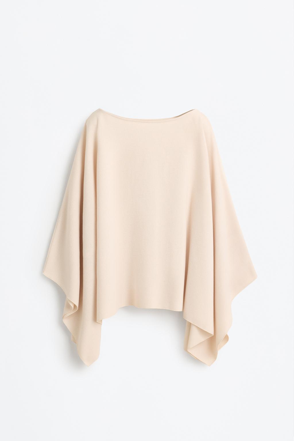Poncho de malha cortada