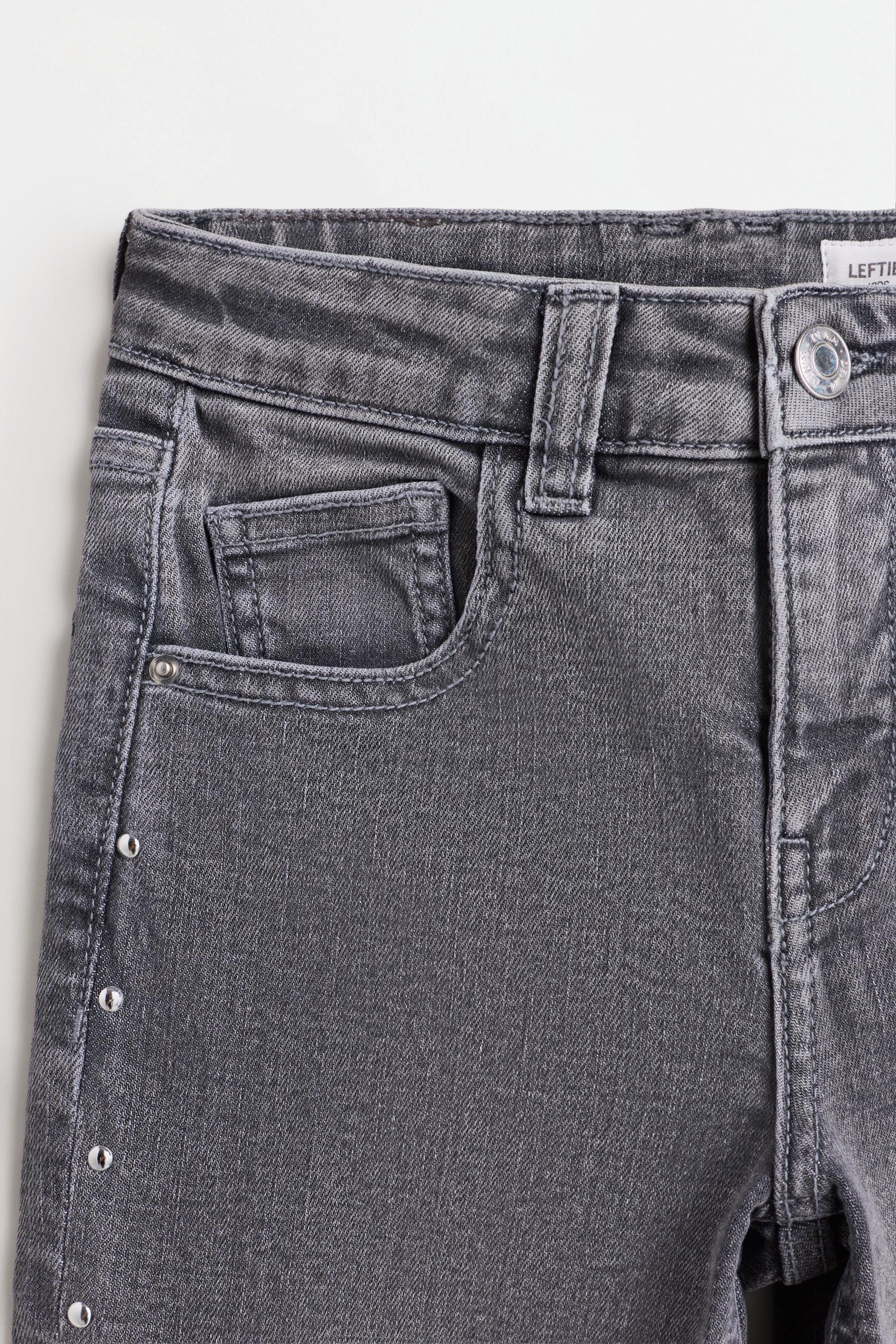 Studded bell bottom jeans — GREY