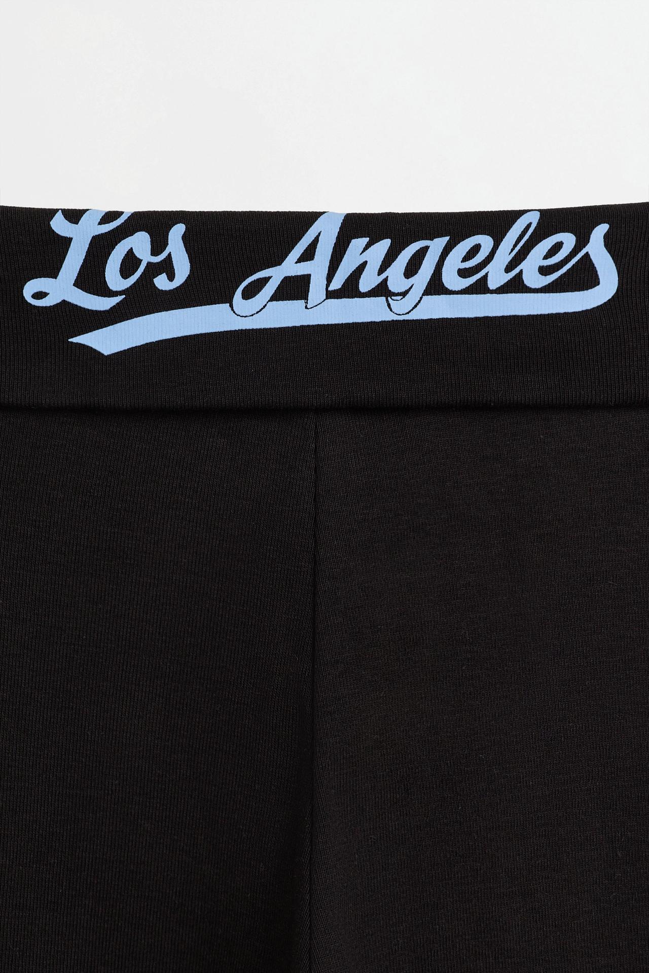 Bell bottom leggings with back text — BLACK