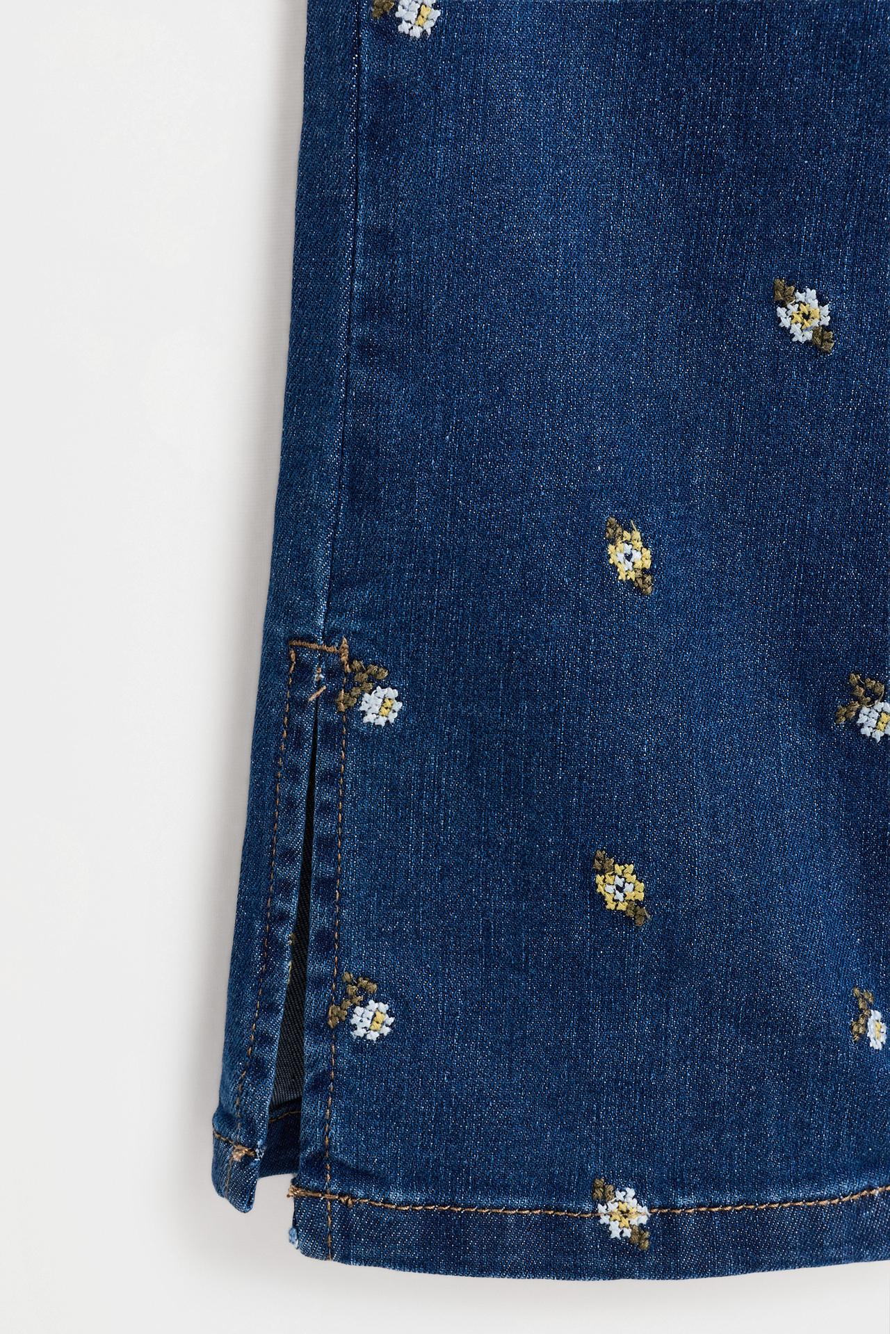 Floral embroidered bell bottom jeans — INDIGO