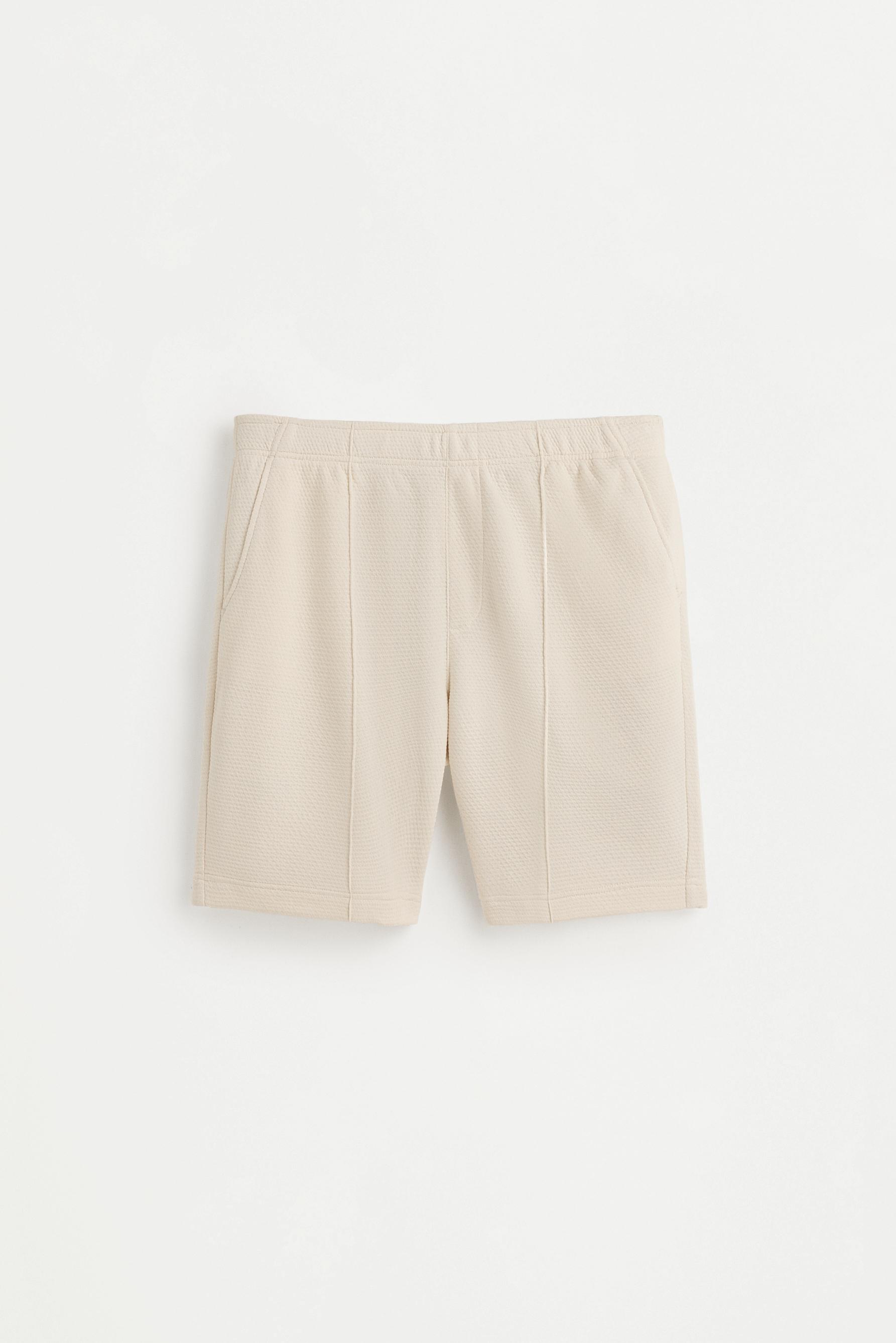 Waffle-textured Bermuda shorts — ECRU