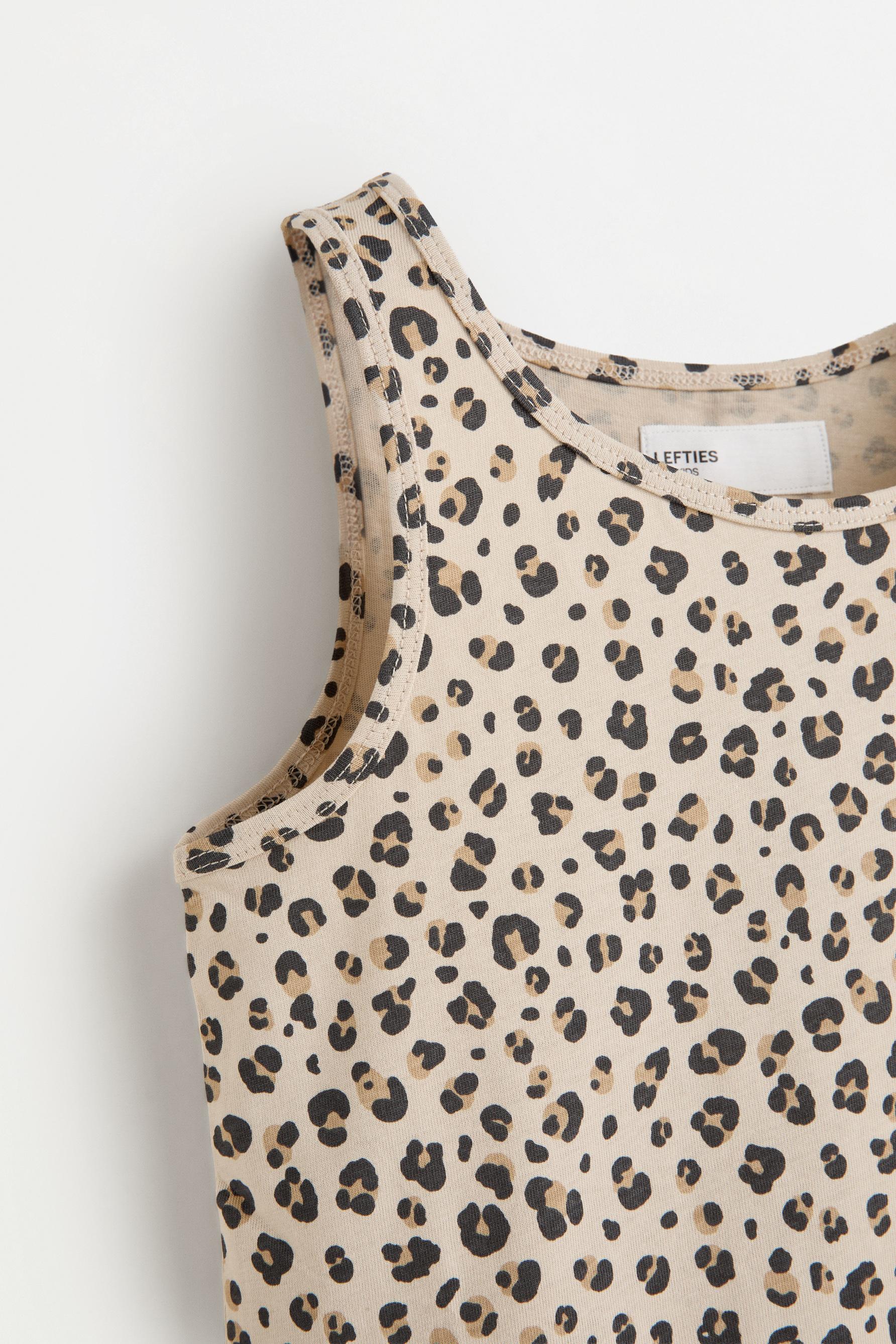 Printed peplum sleeveless t-shirt — HIELO