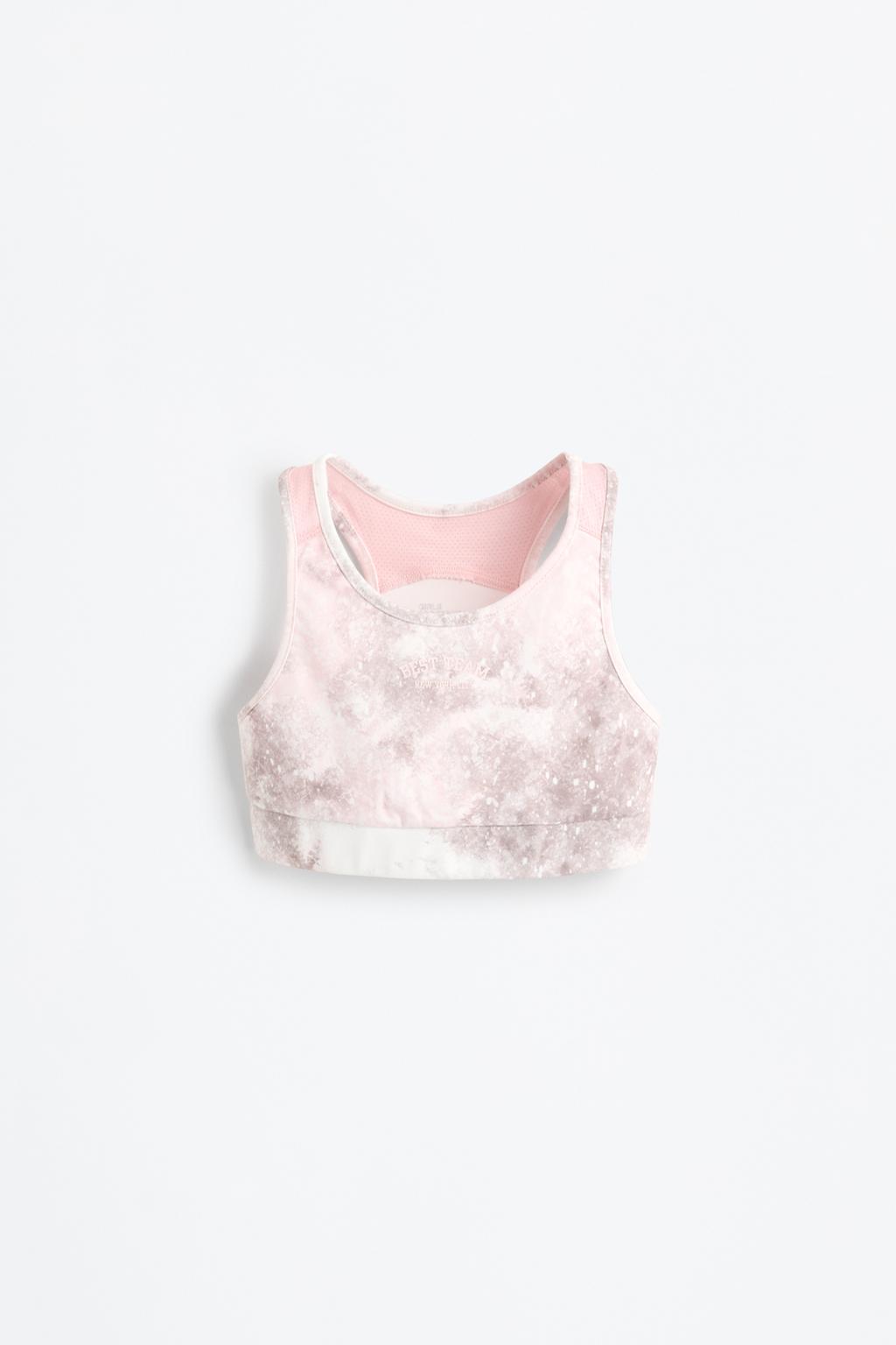Printed sports top with rubberised slogan