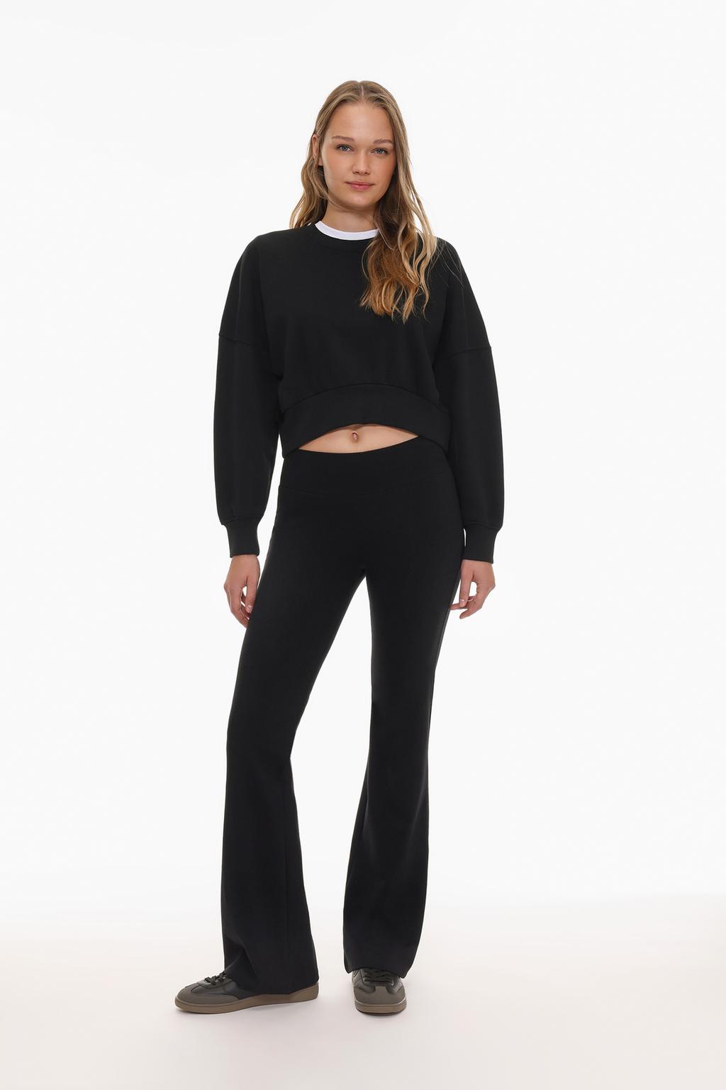 Flared leggings with ribbed waist