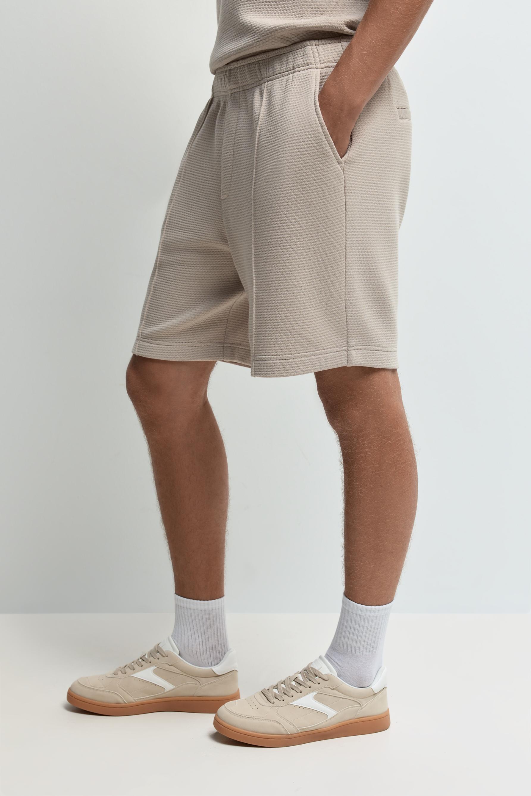 Waffle-textured Bermuda shorts — PALE SAND