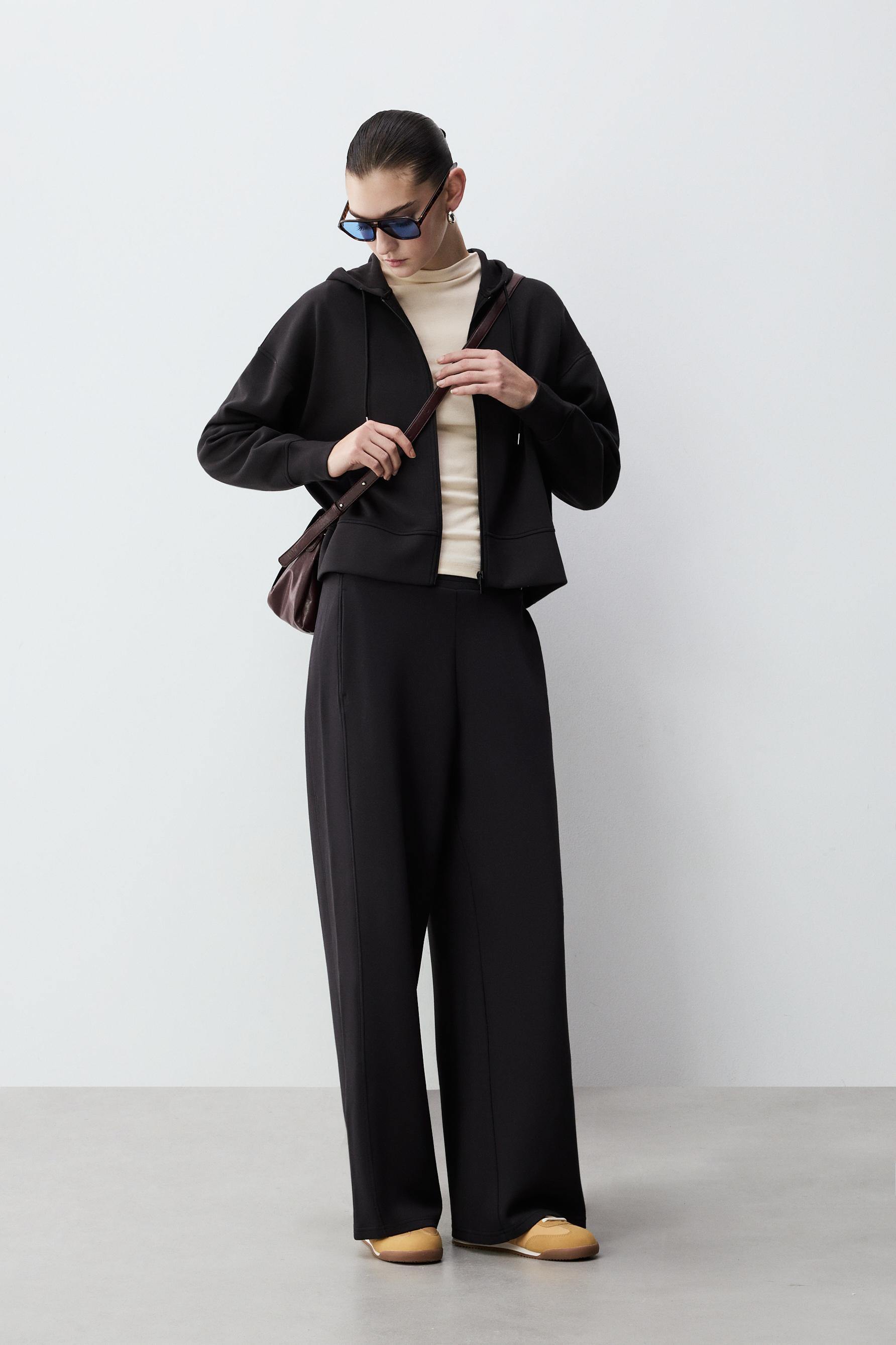 Pantalón carrot felpa fluida