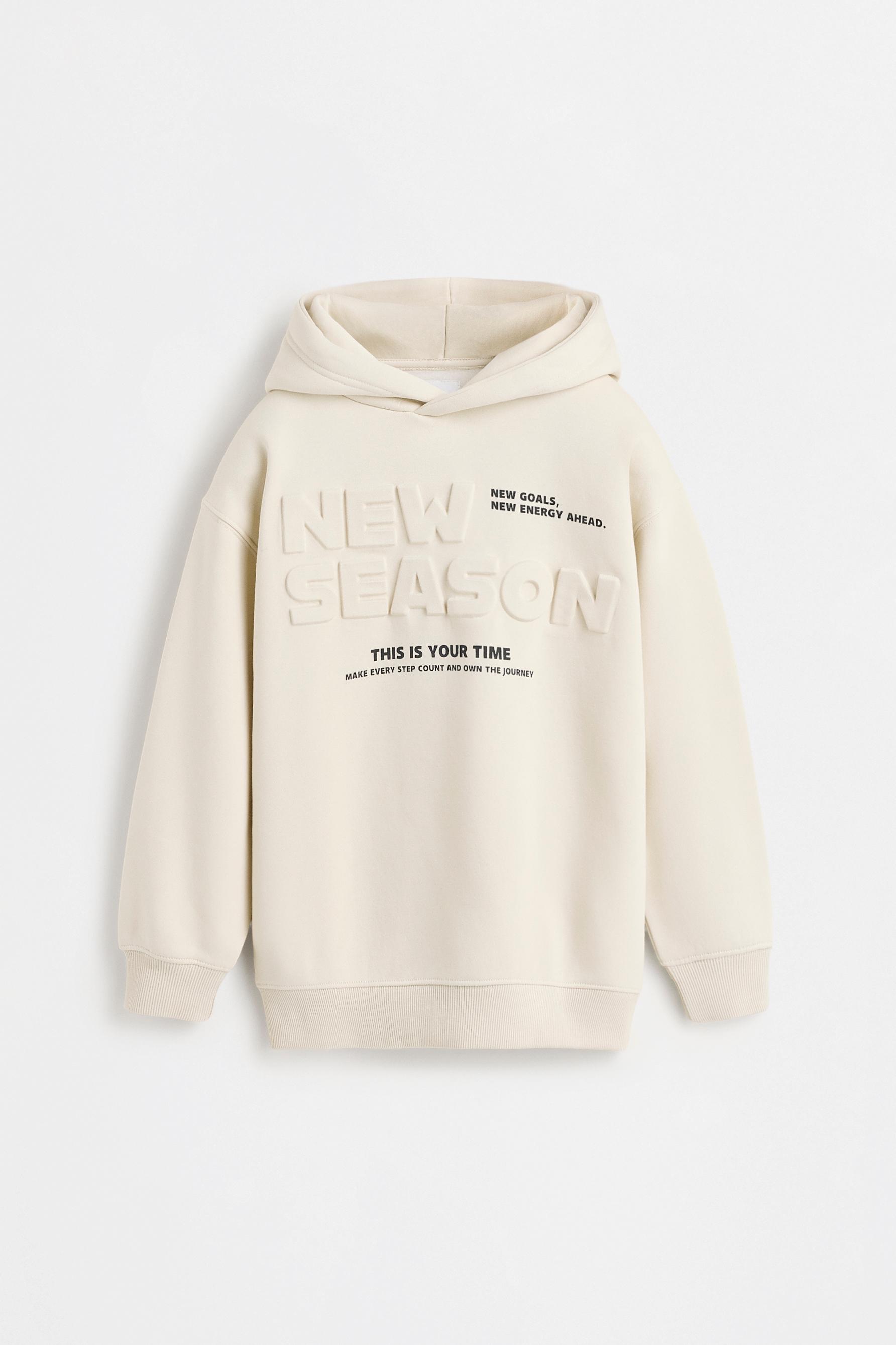 Hoodie with raised text — GREY