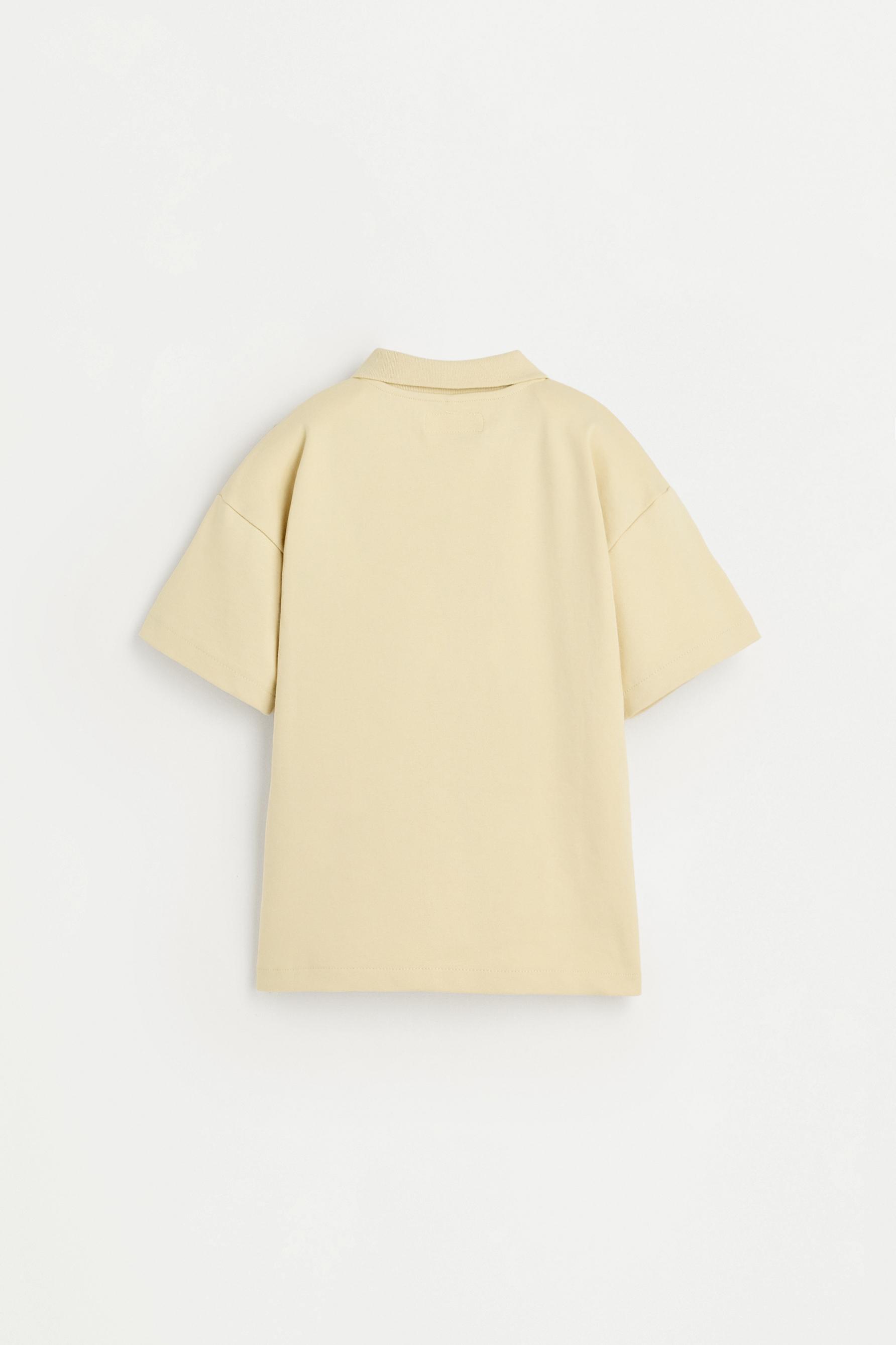 Interlock polo shirt with text — VANILLA