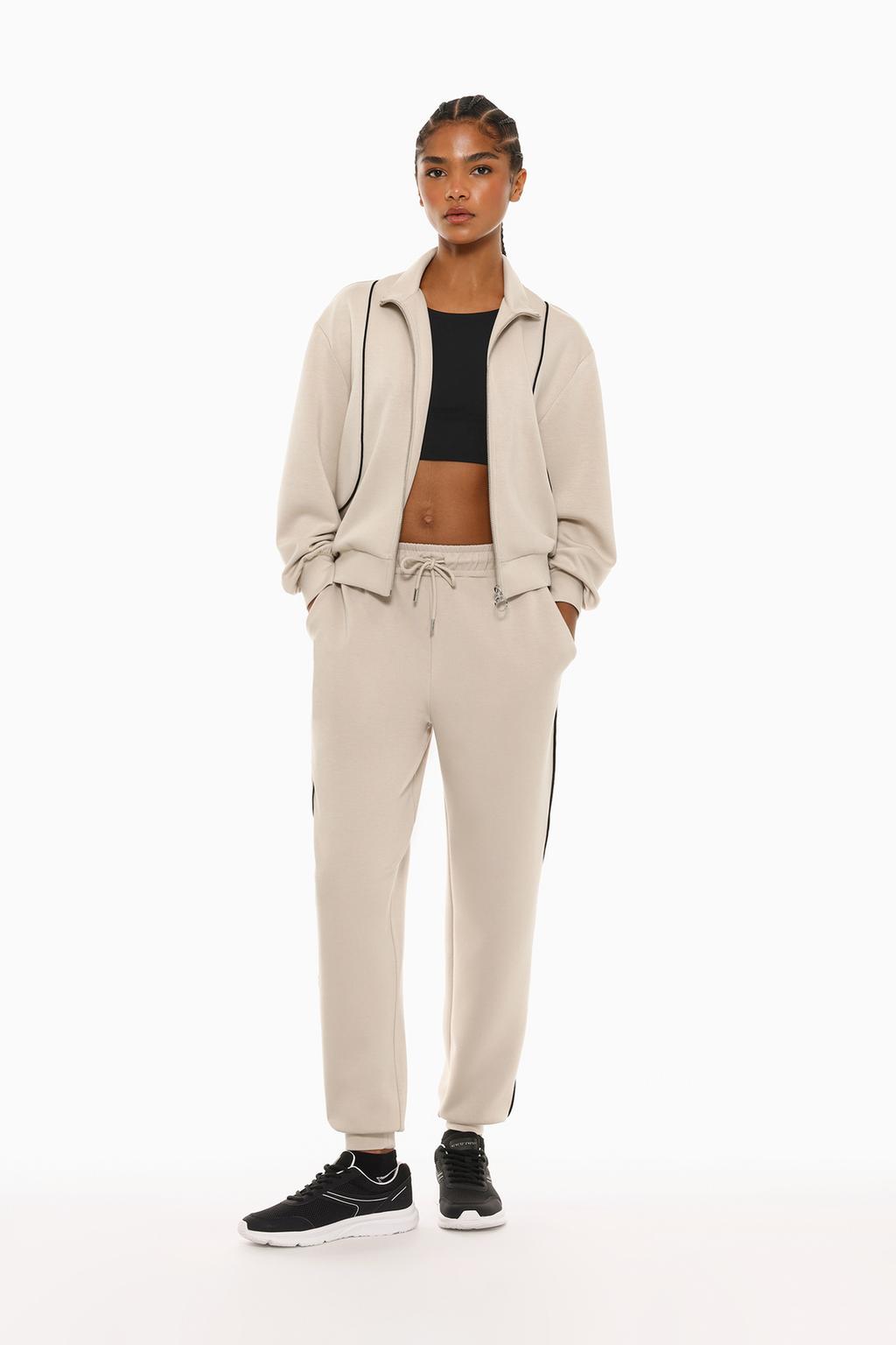 Flowing tracksuit trousers with trim details