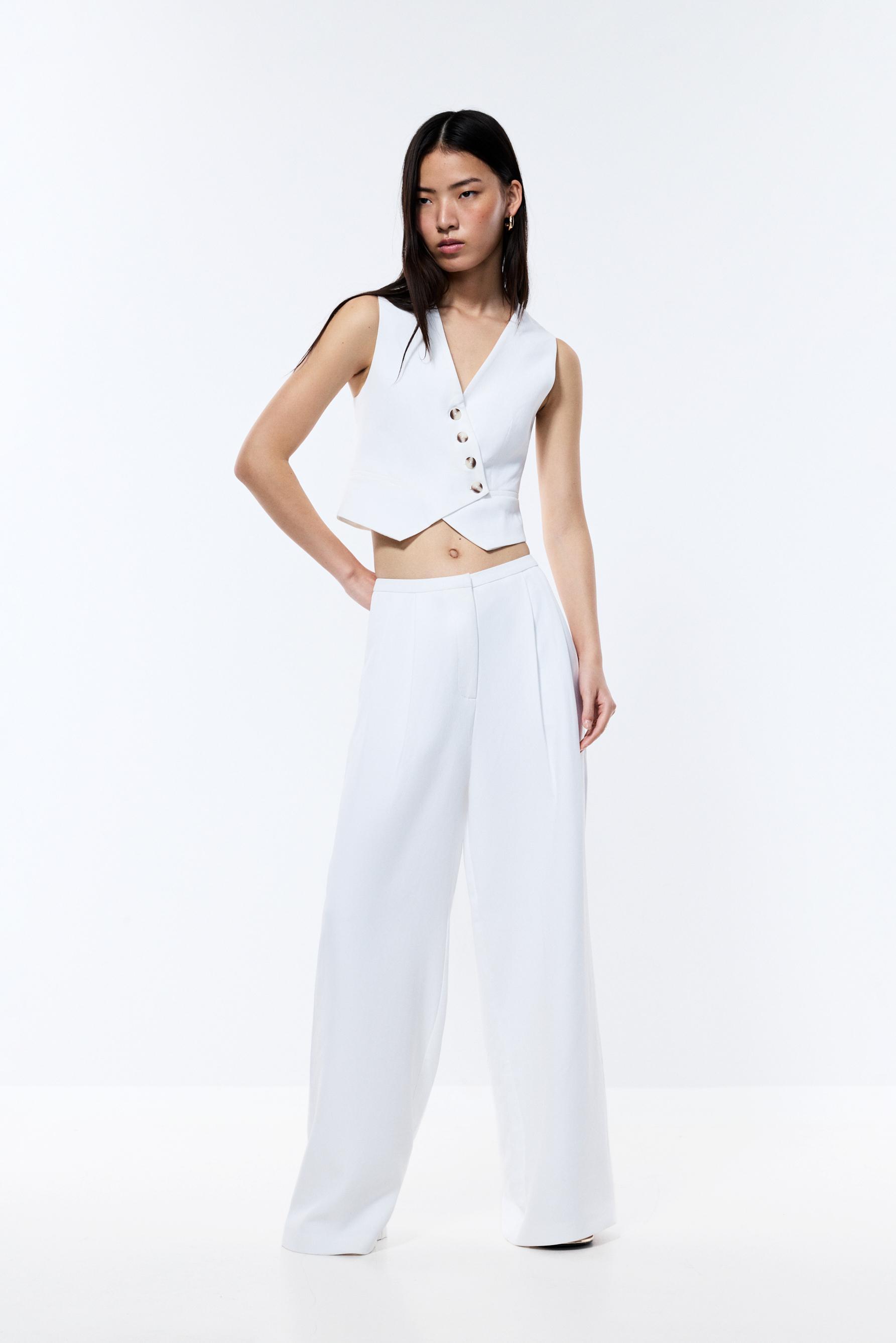 Pantalón recto pliegues