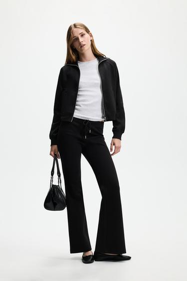 Basic interlock bell bottom trousers — BLACK 1