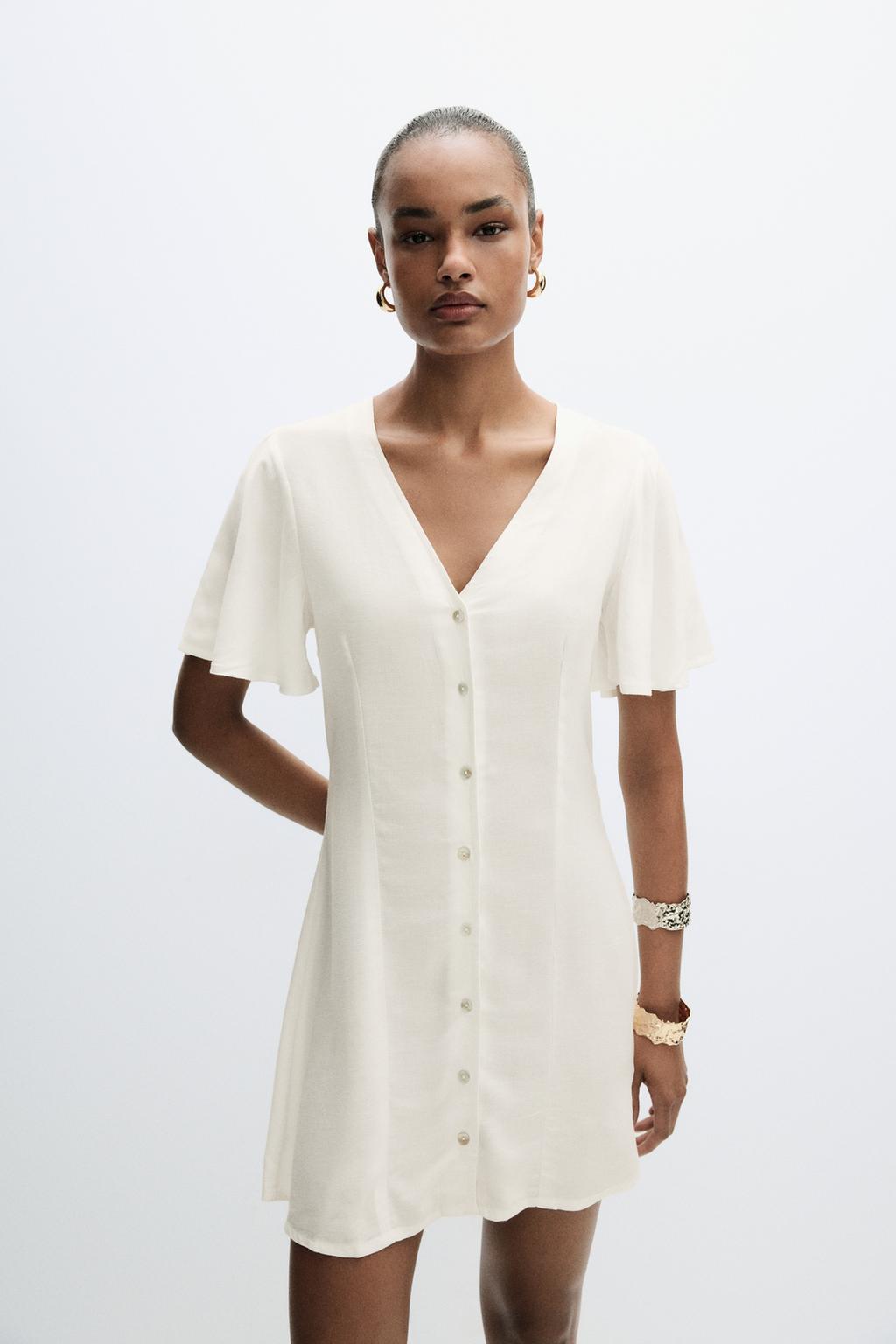 Rustic dress with cape sleeves