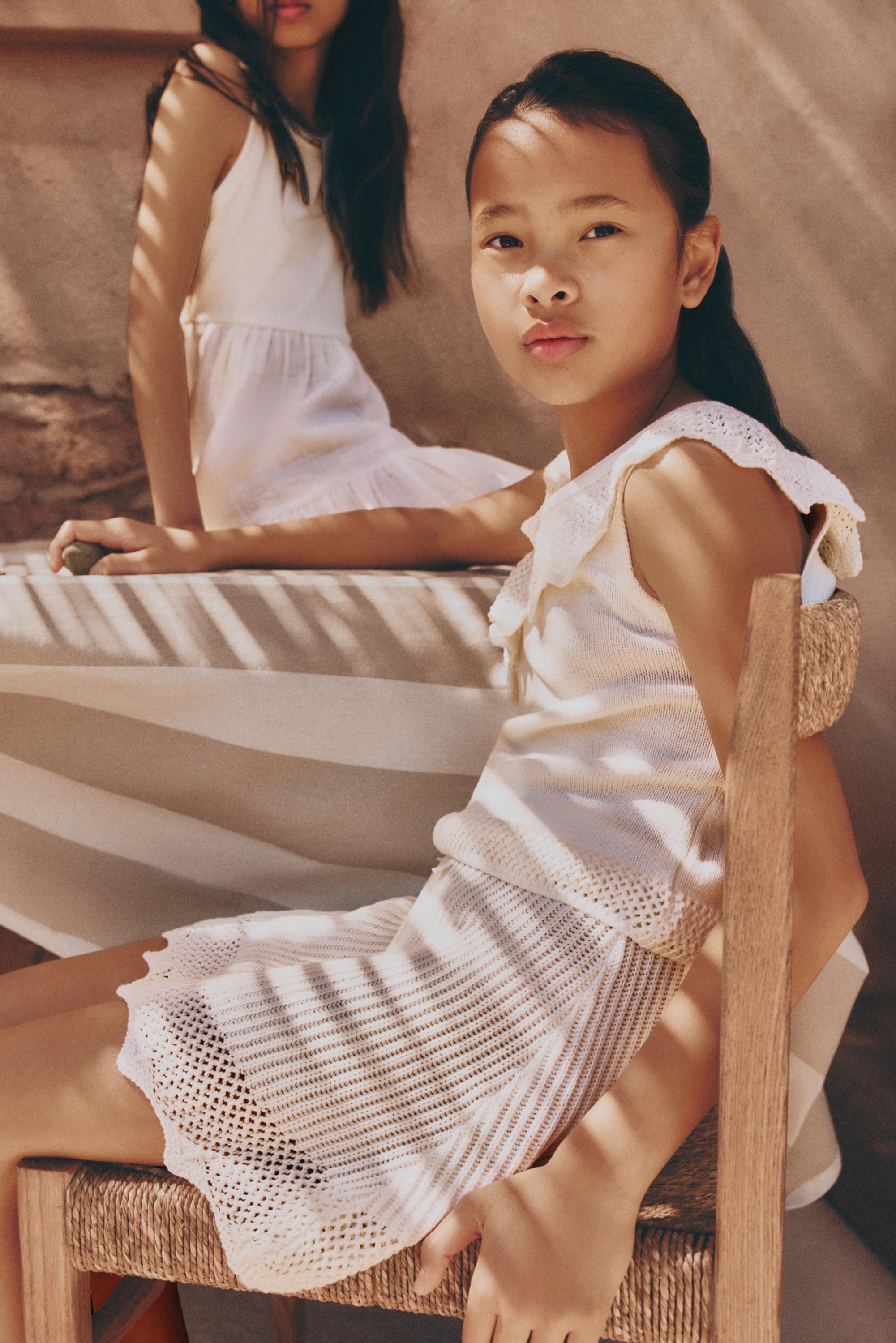 Asymmetric knit top — OFF WHITE
