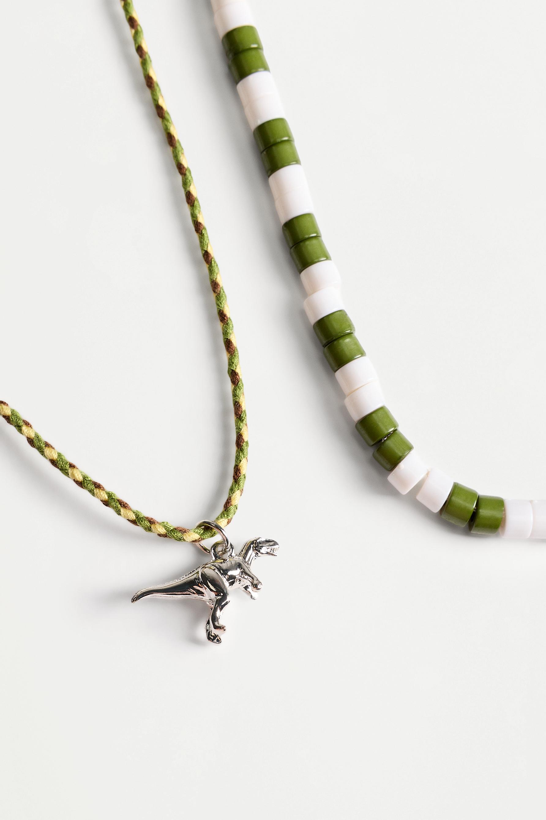 Double dinosaur necklace — VARIOUS