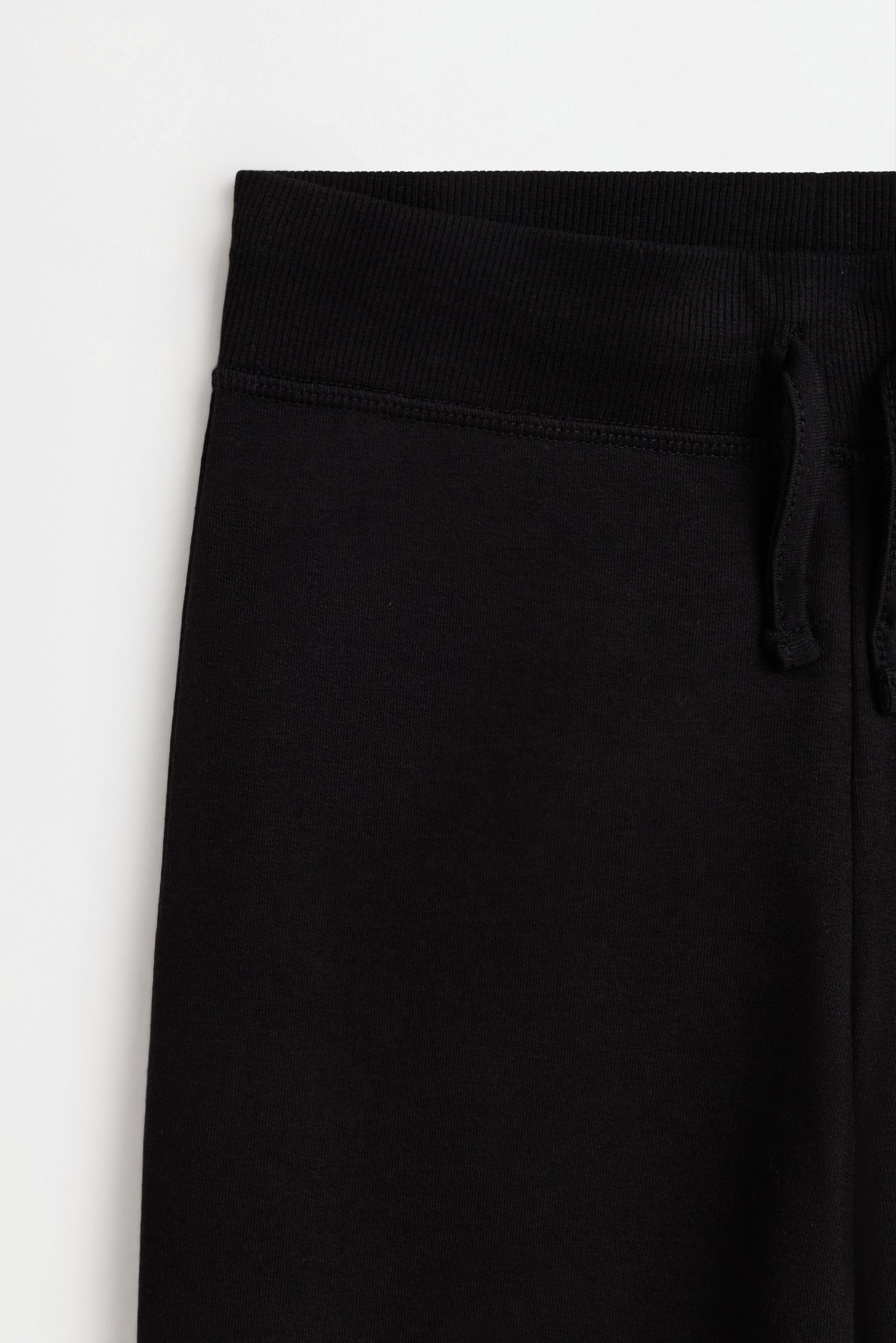 Star print fleece bell bottom leggings — BLACK