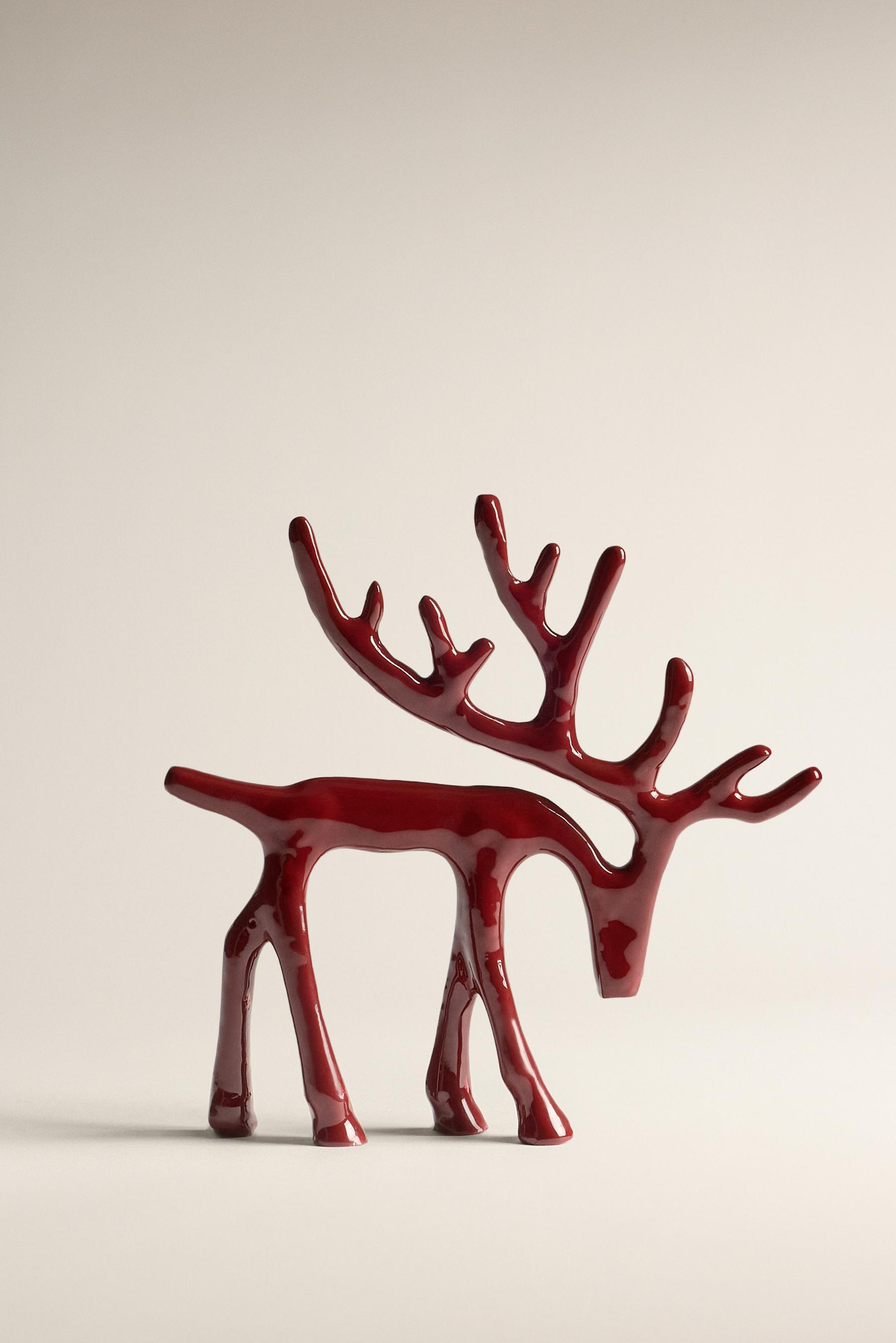 Figura decorativa reno