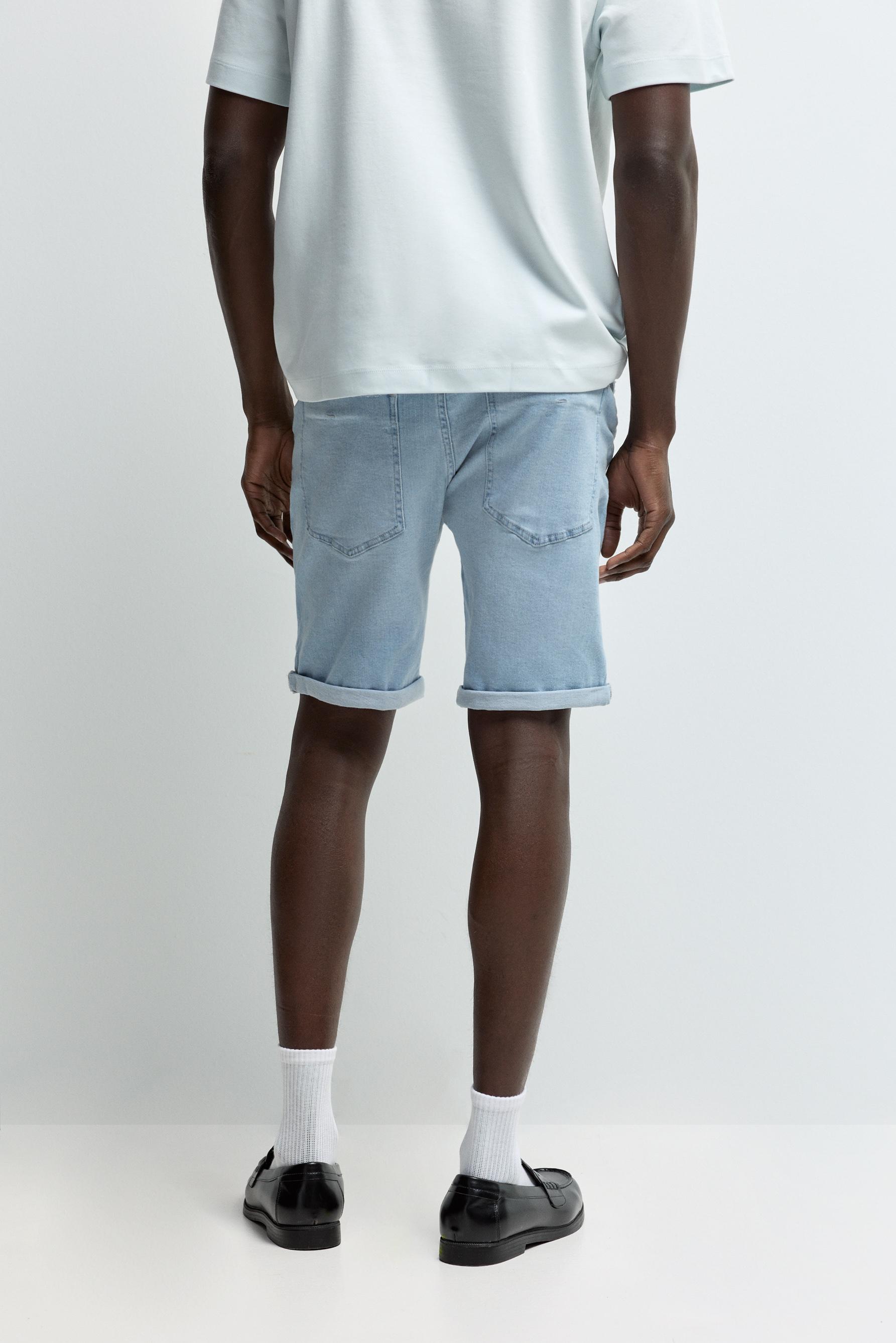 Distressed skinny denim Bermuda shorts — PALE BLUE