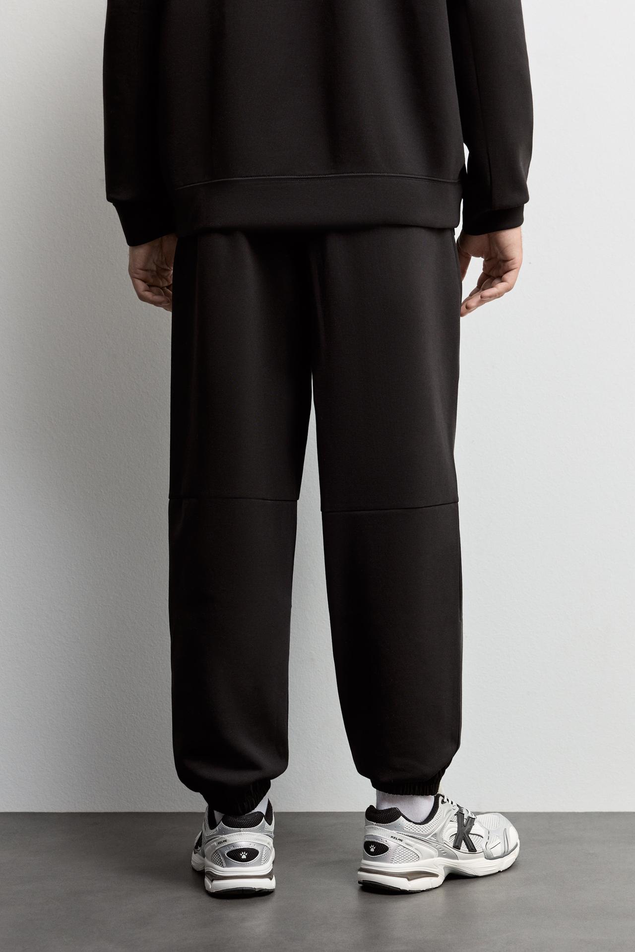 Wide-leg interlock trousers — BLACK
