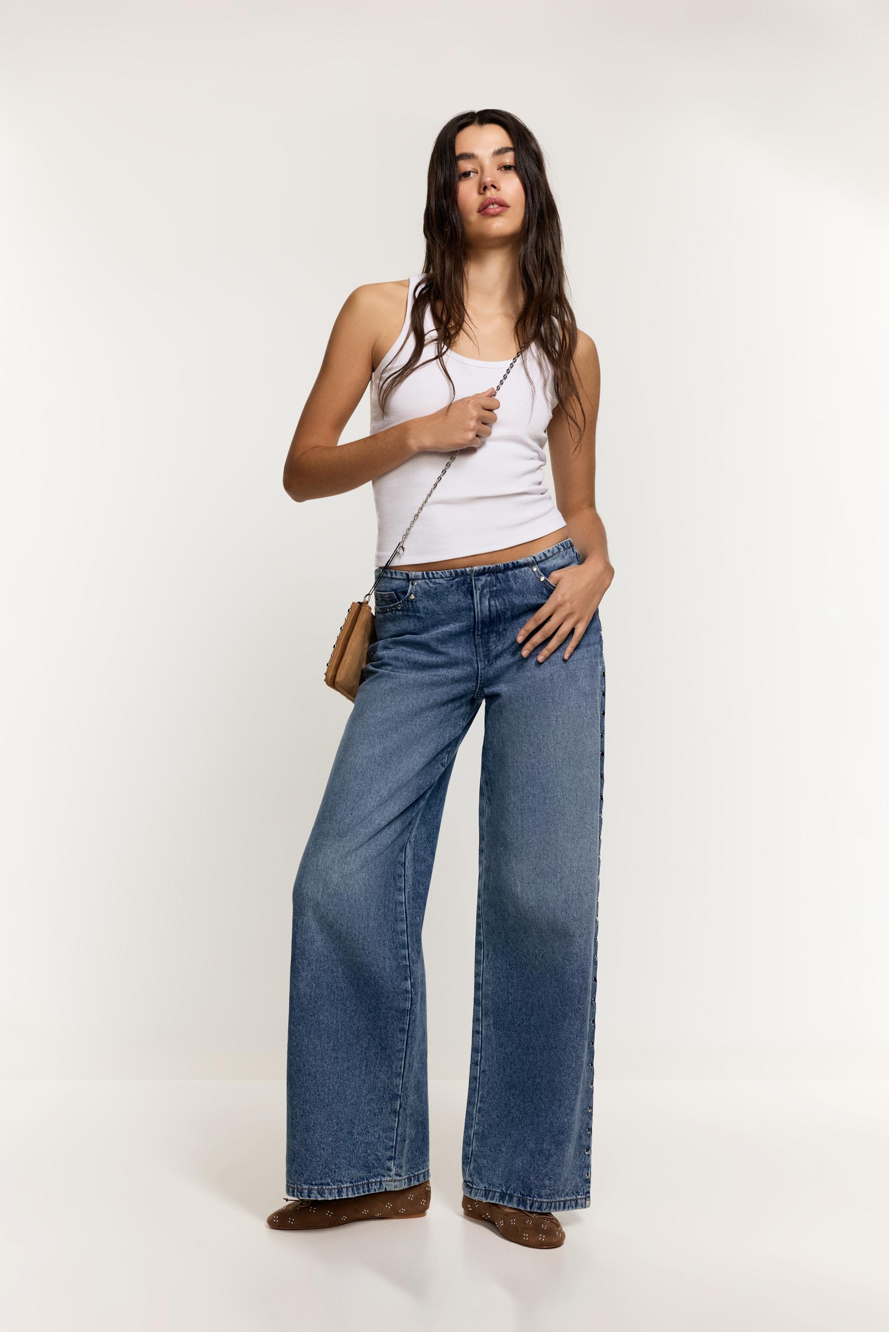 Jeans wide leg sin cintura tachas