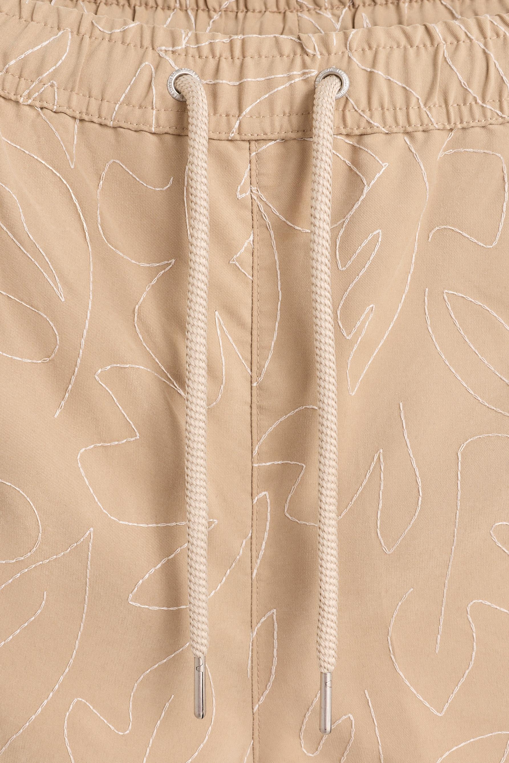Embroidered regular swim shorts — BEIGE