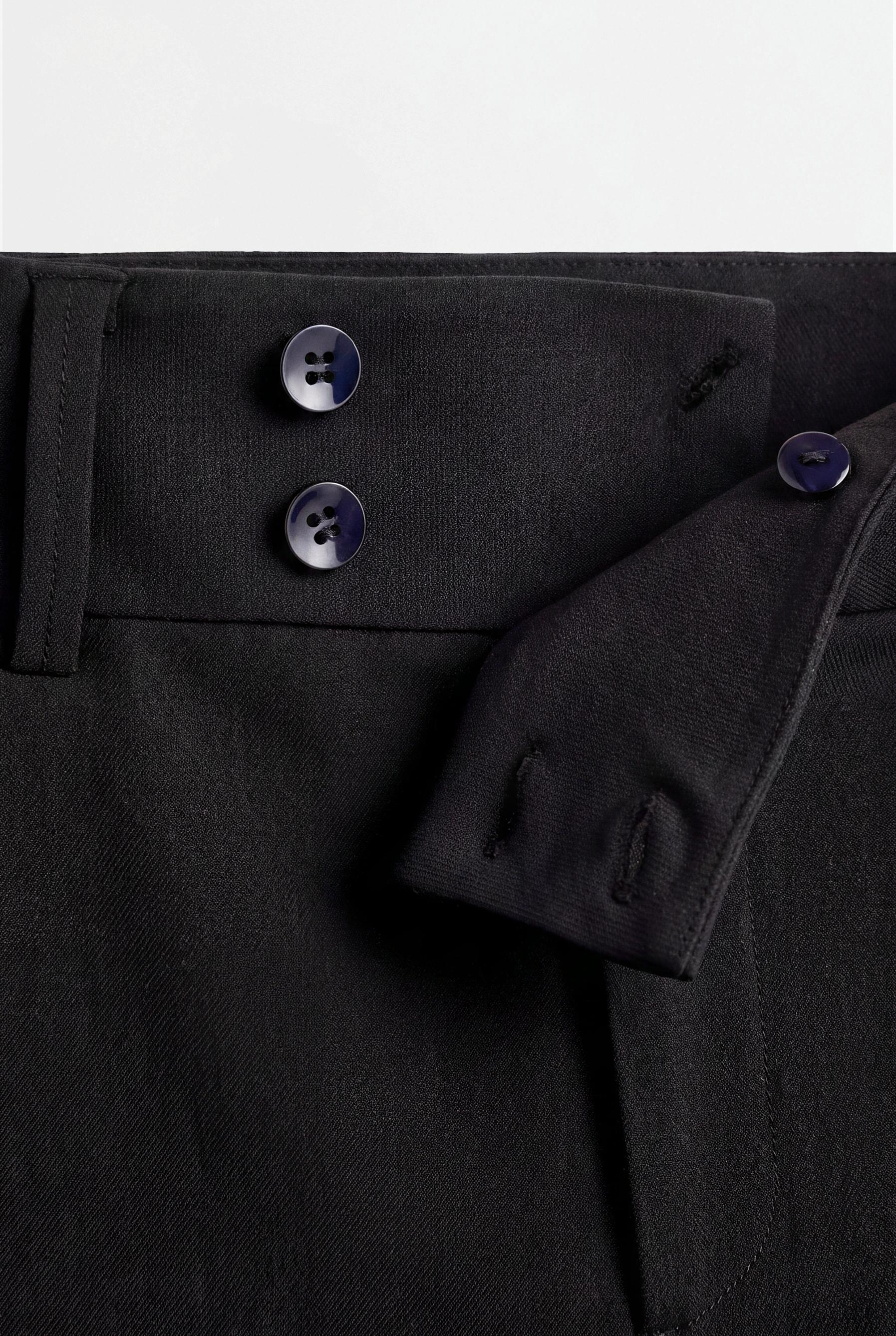 Striped bell bottom trousers — BLACK