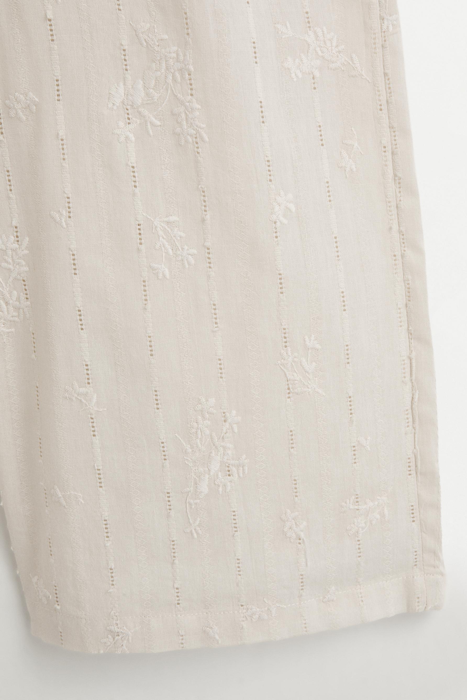 Embroidered trousers — SAND