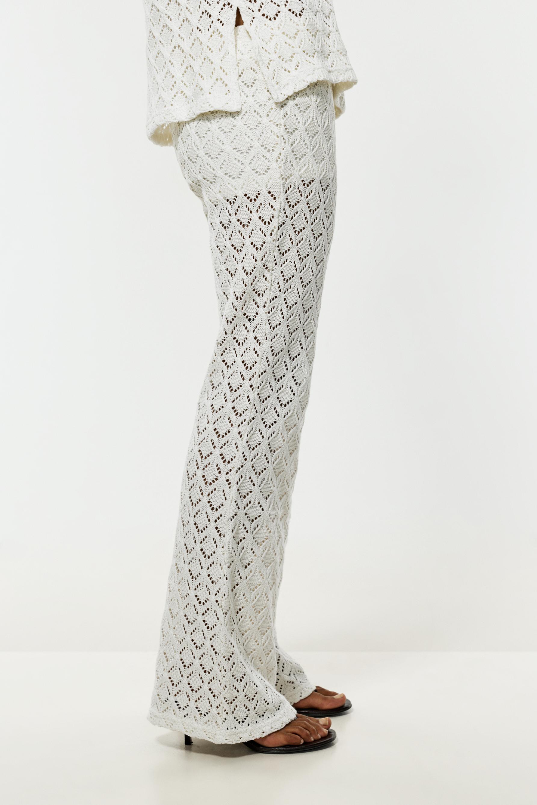 Crochet-effect bell bottom trousers — OFF WHITE