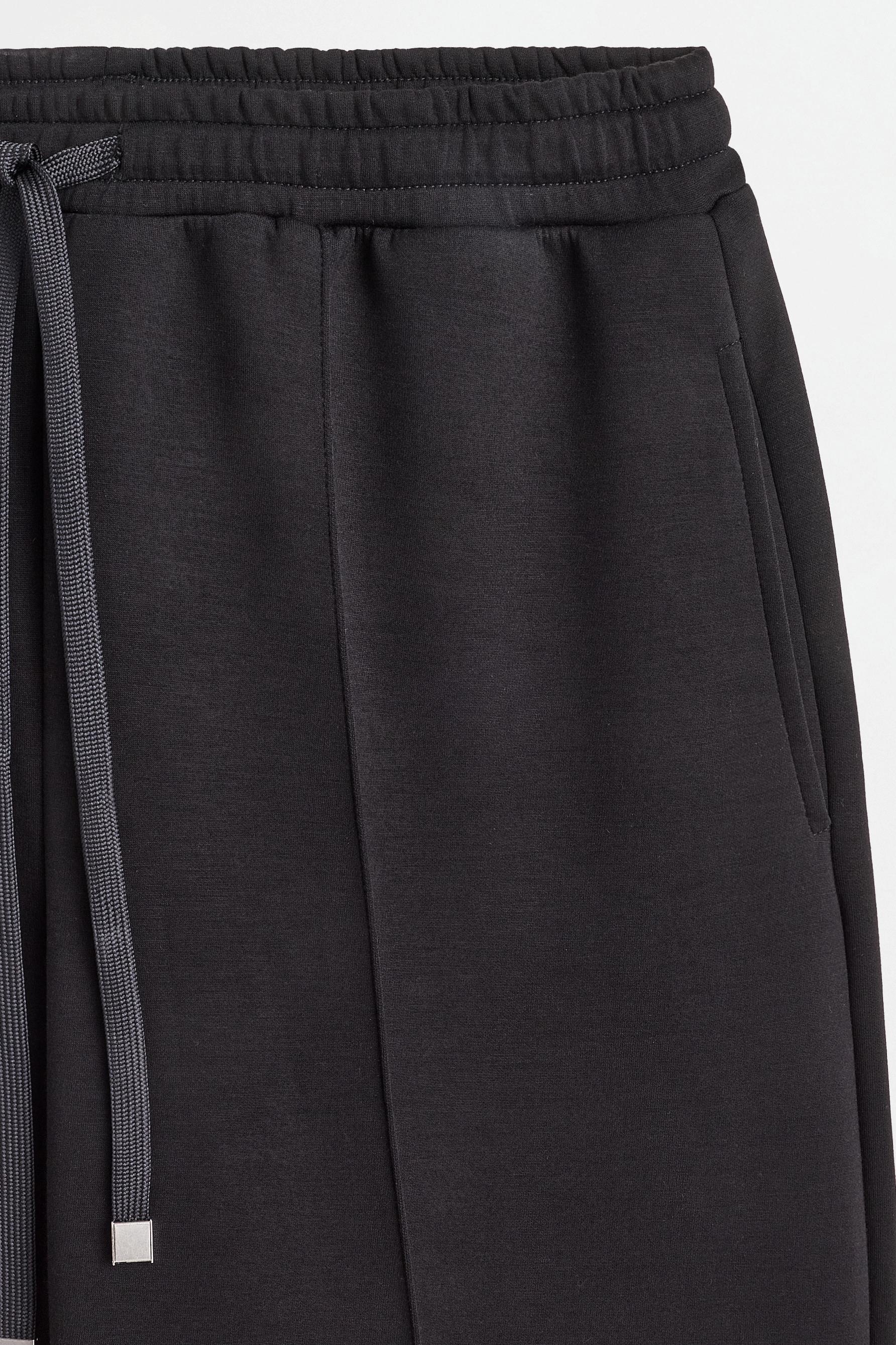Wide-leg tracksuit trousers with front seam — BLACK