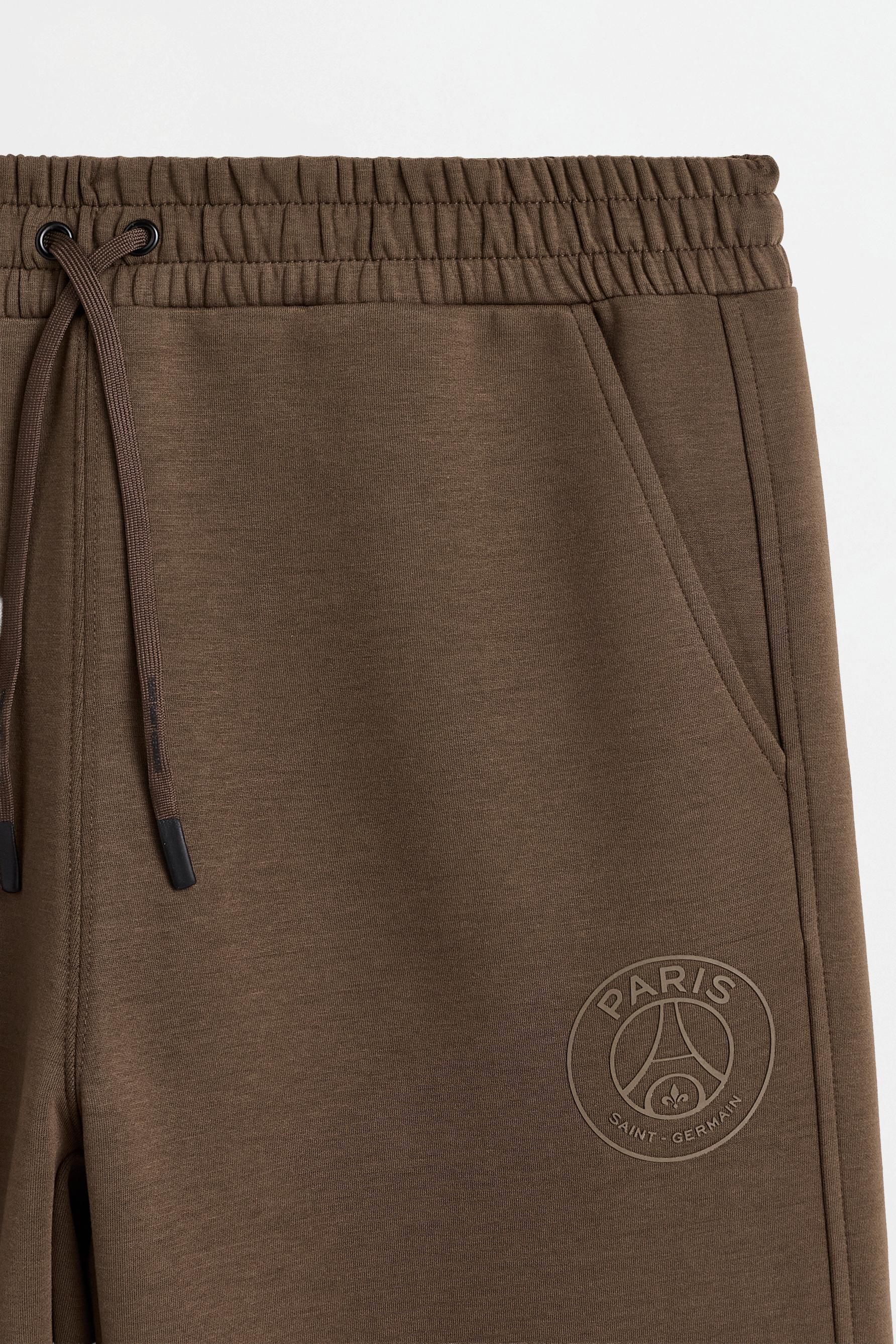 Paris Saint-Germain interlock pants — BROWN