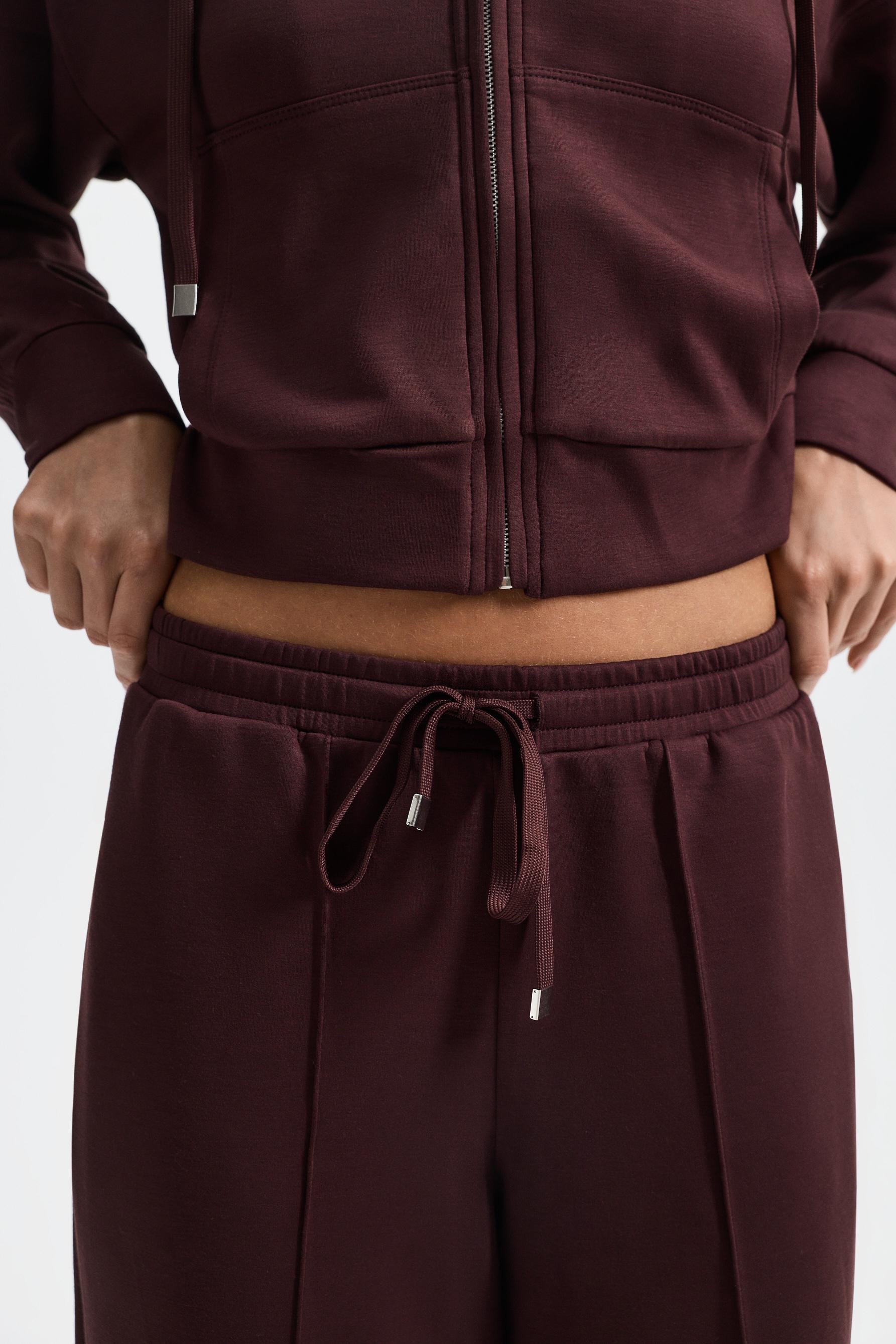 Wide-leg tracksuit trousers with front seam — WINE