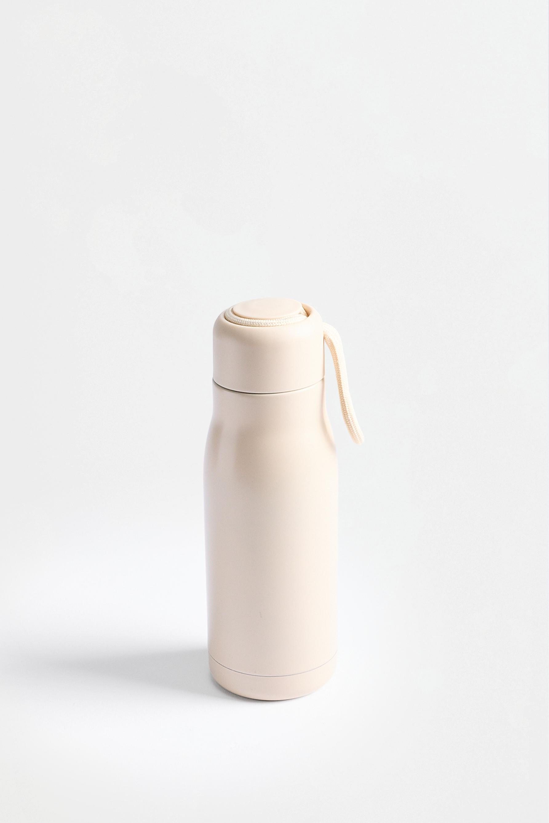 Metallic travel bottle — ECRU