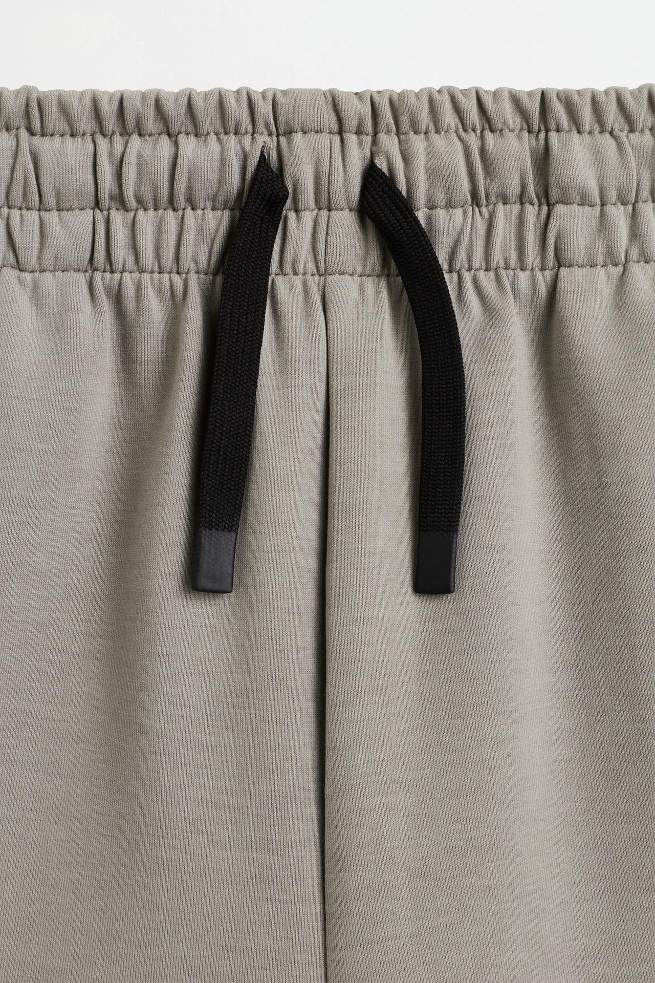 Neoprene-effect trousers — PALE KHAKI