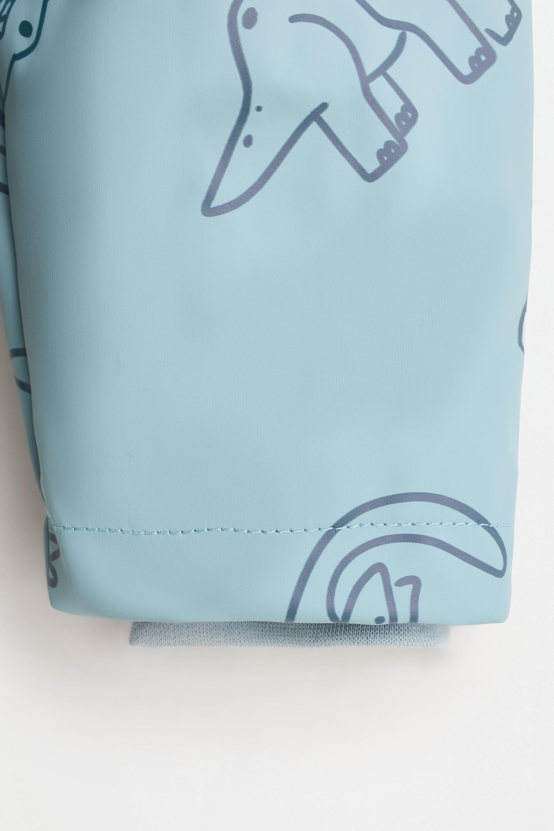 Rubberised raincoat — INDIGO