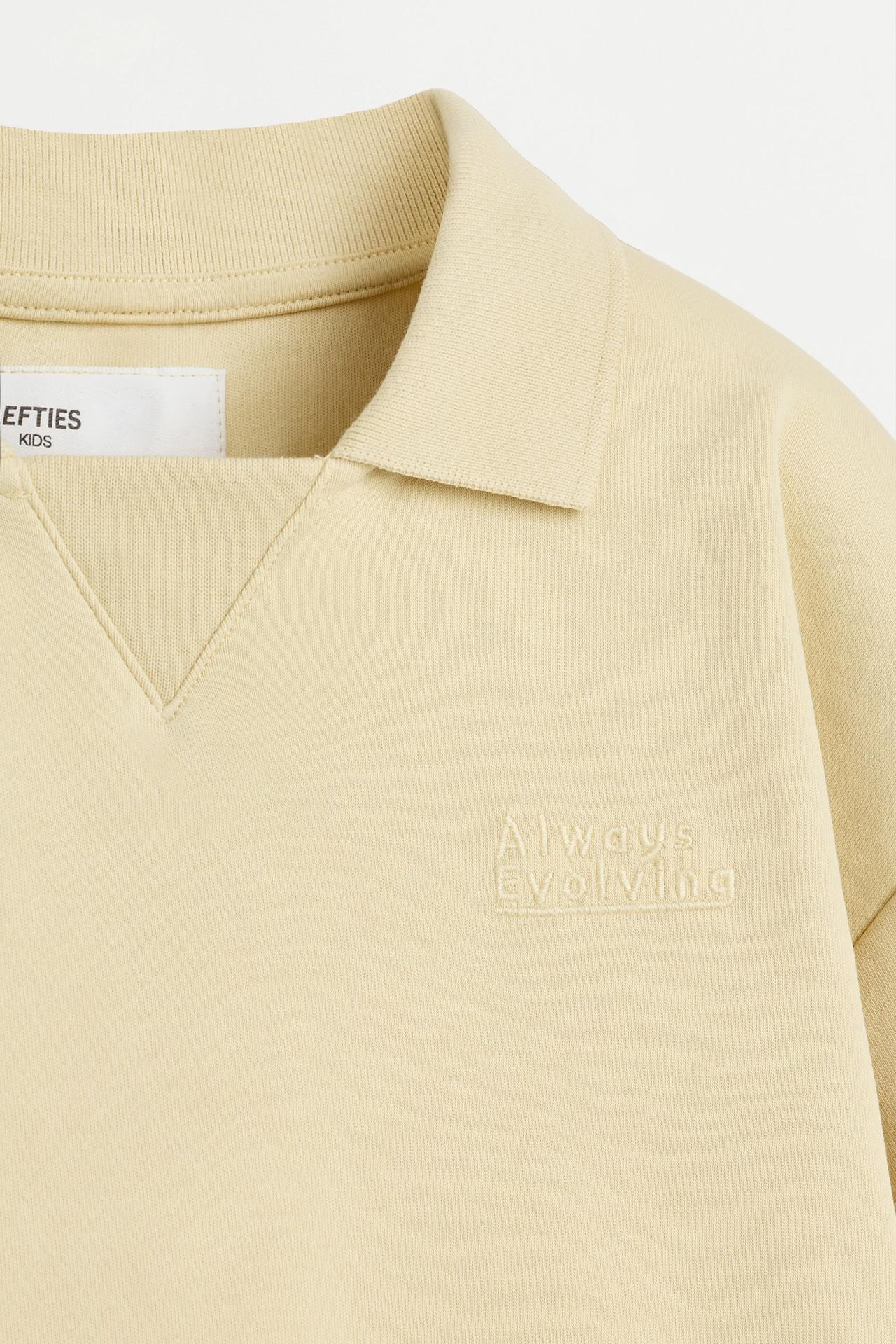 Interlock polo shirt with text — VANILLA