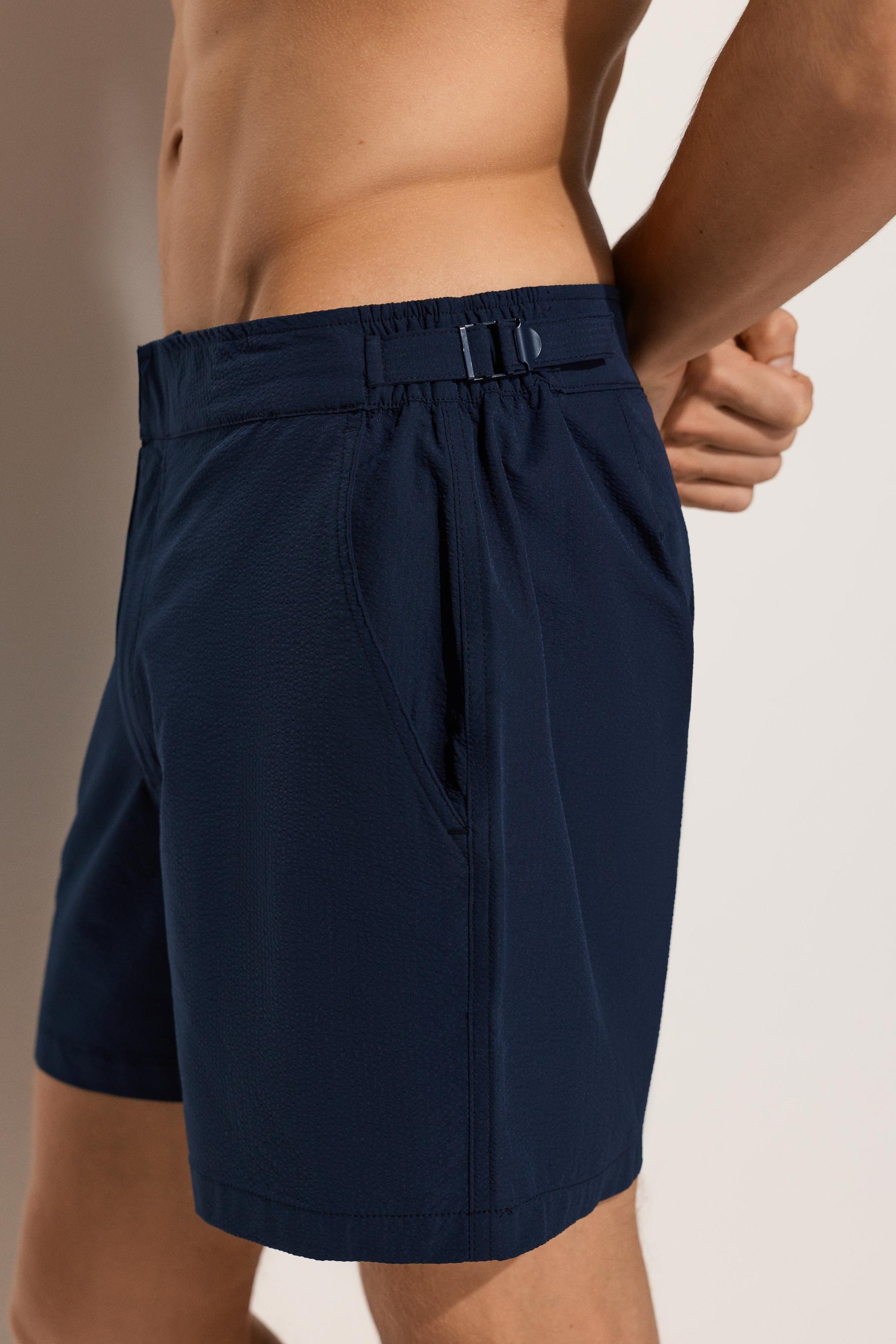 Short swim trunks with buckles — NAVY