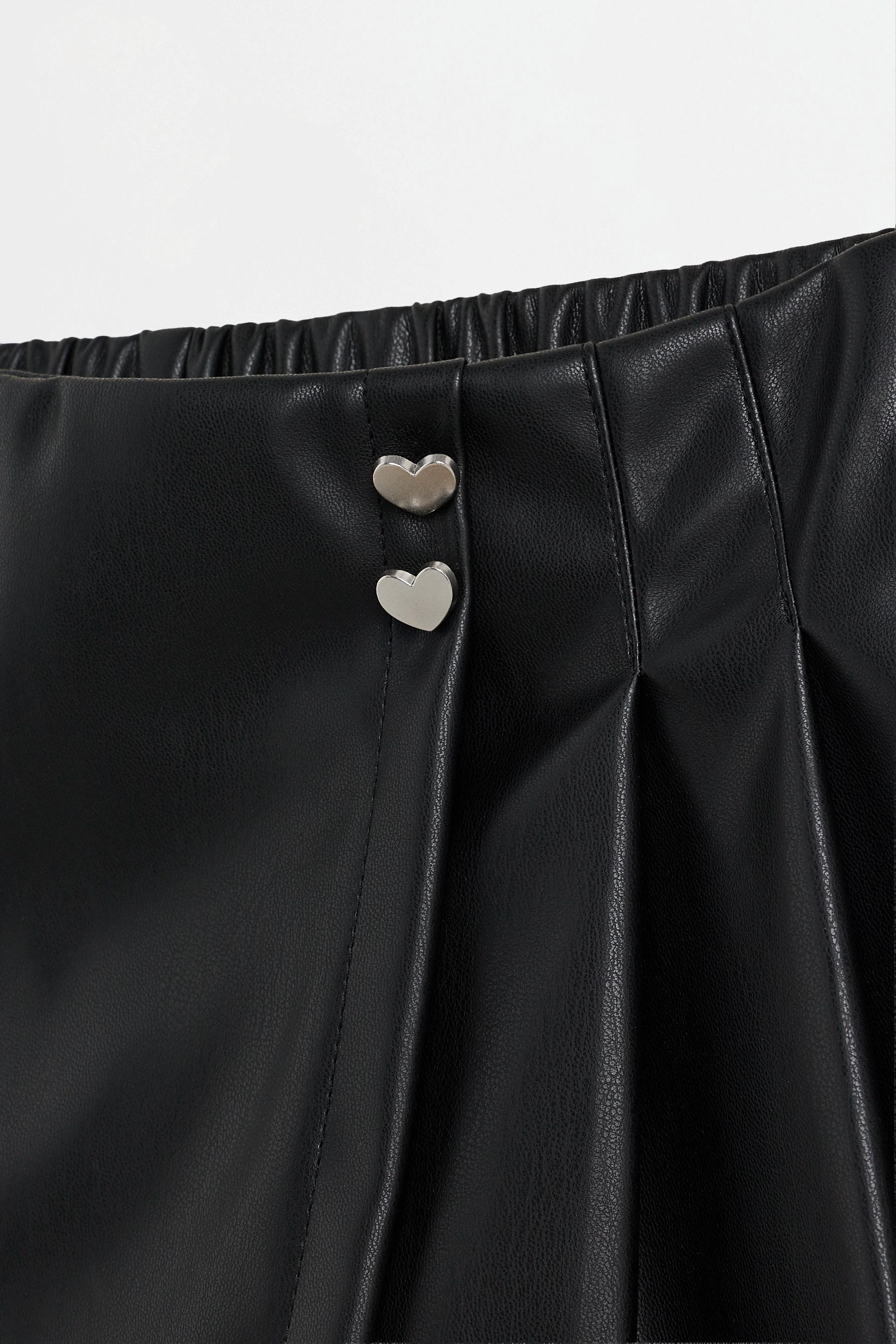 Leather effect skort with hearts — BLACK