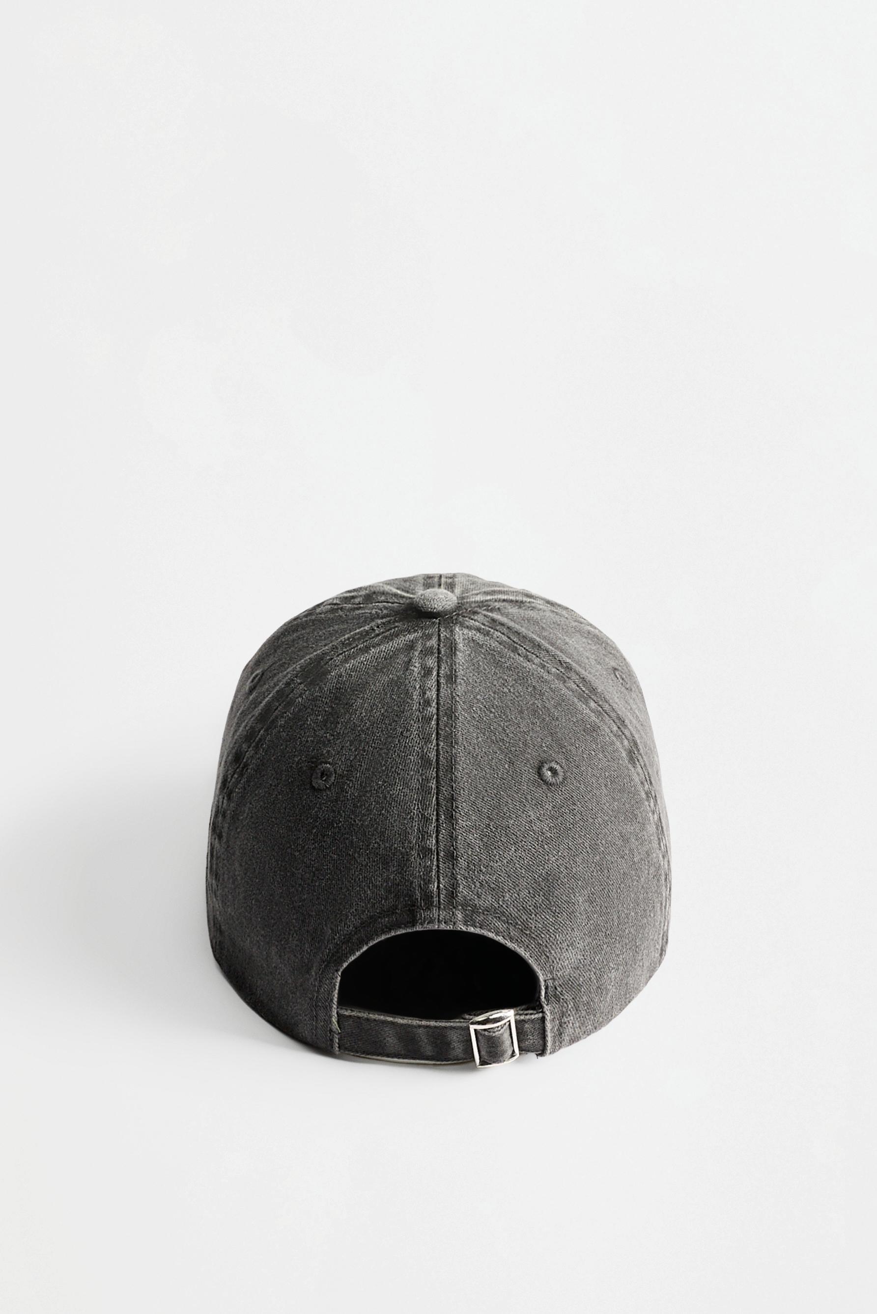 Faded-effect embroidered cap — BLACK