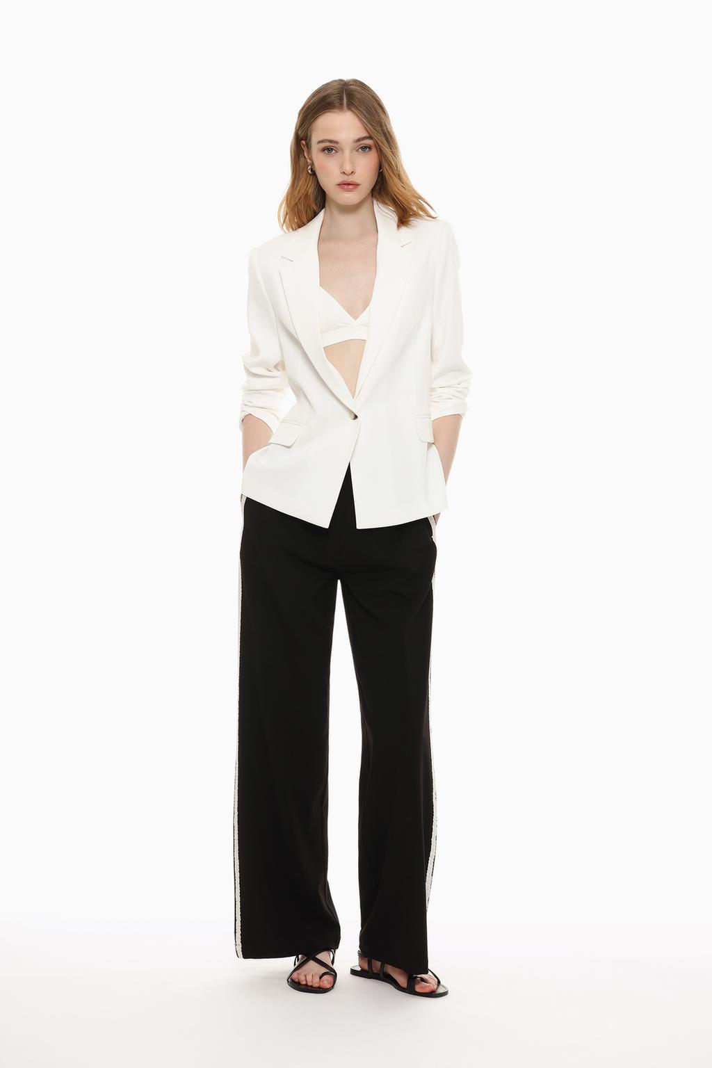Trousers with lace trim stripe