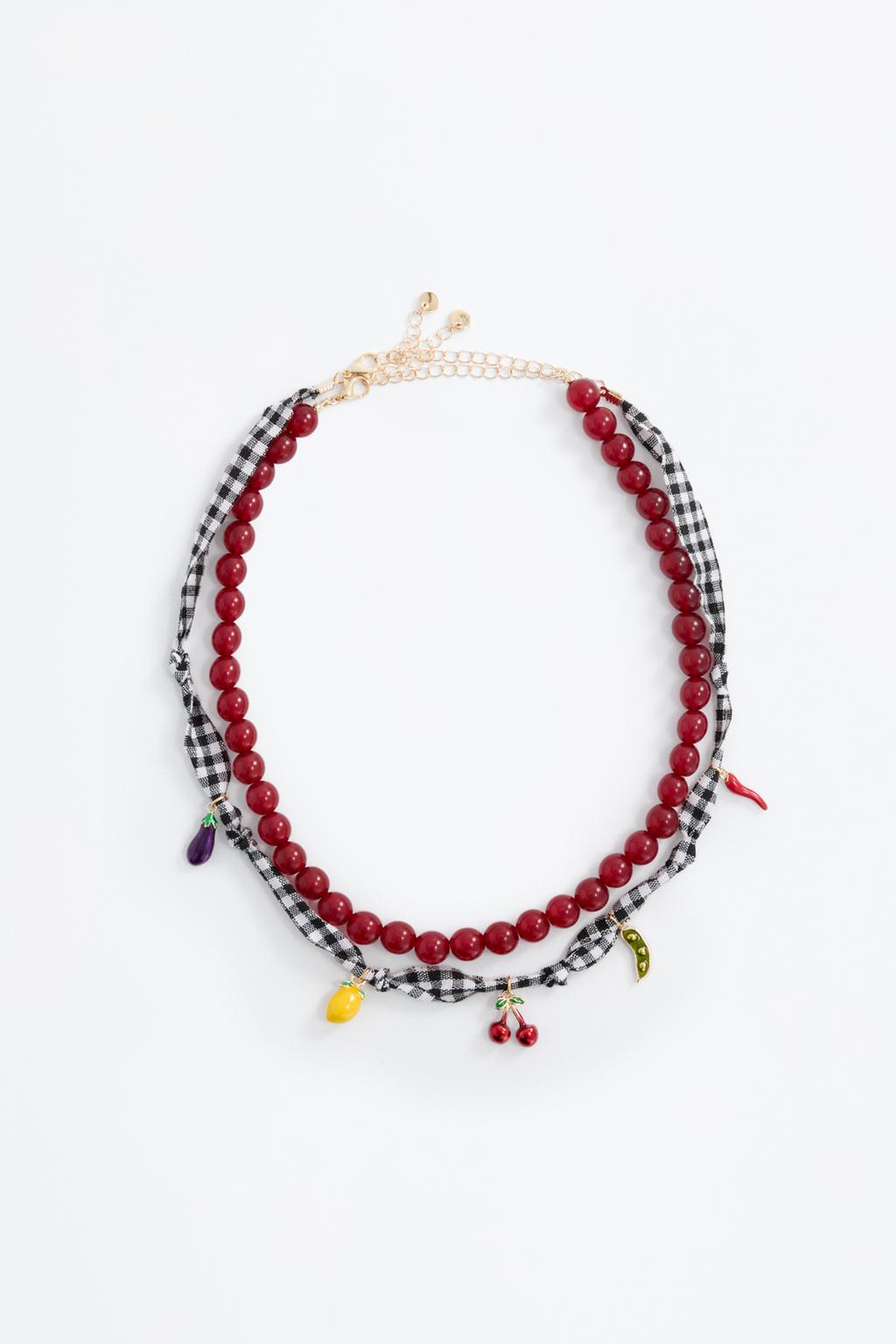 Multi-strand necklace with contrast fruit