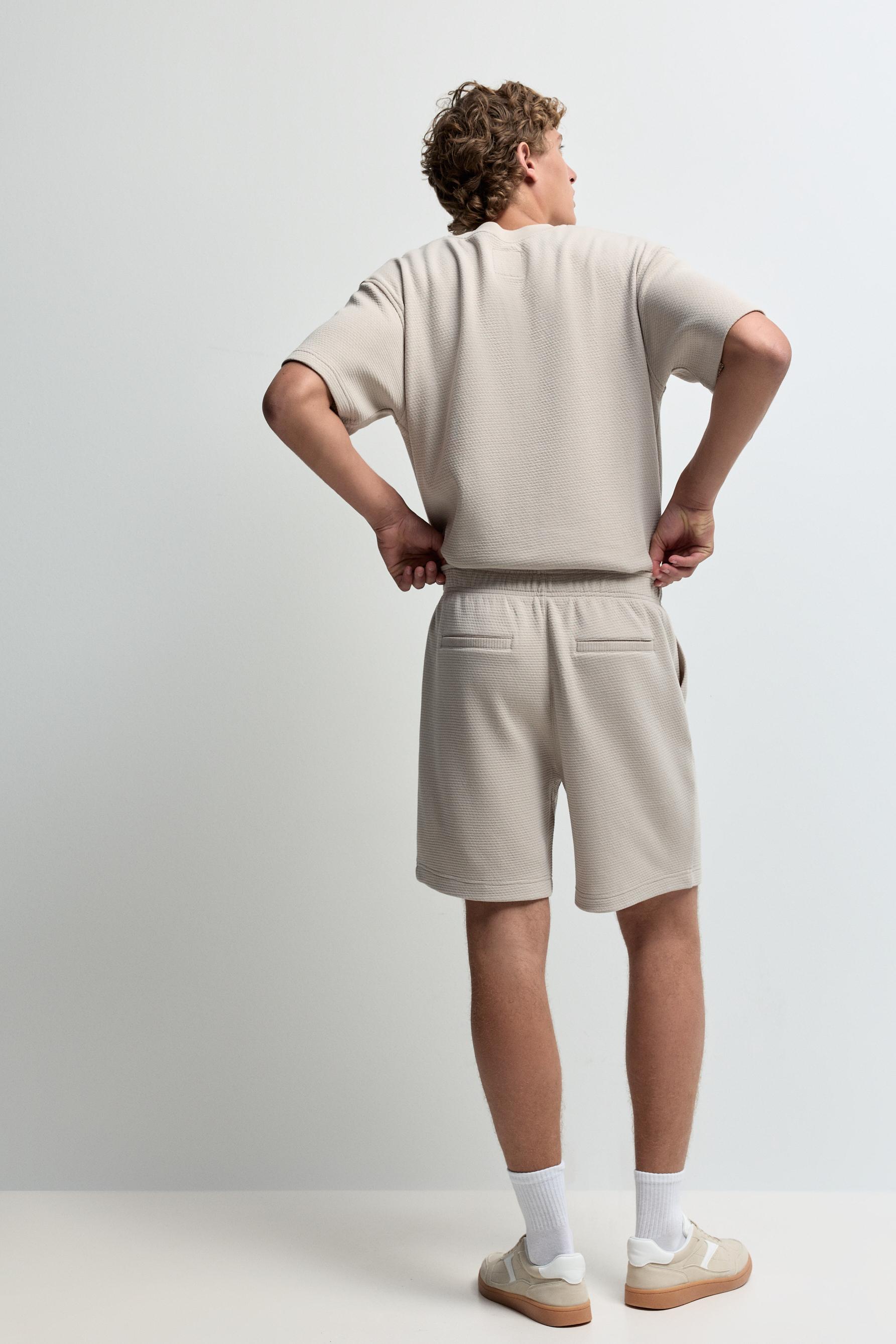 Waffle-textured Bermuda shorts — PALE SAND