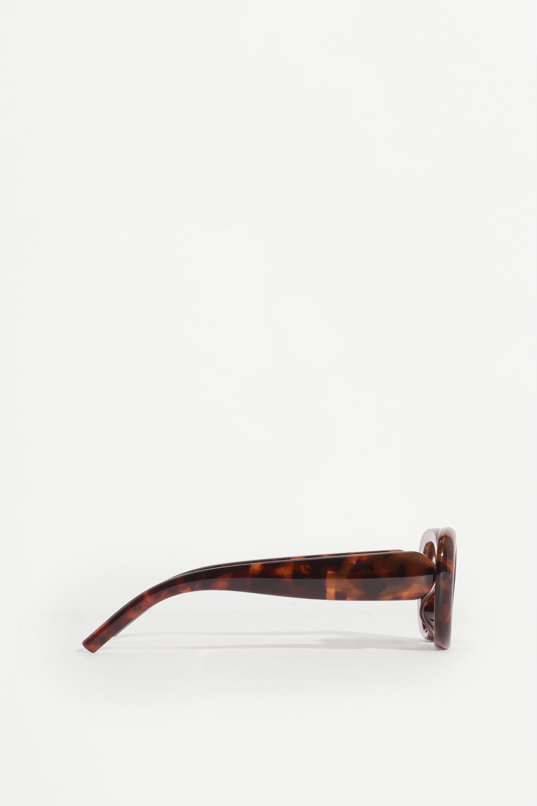 Oval tortoiseshell-effect glasses — TORTOISESHELL